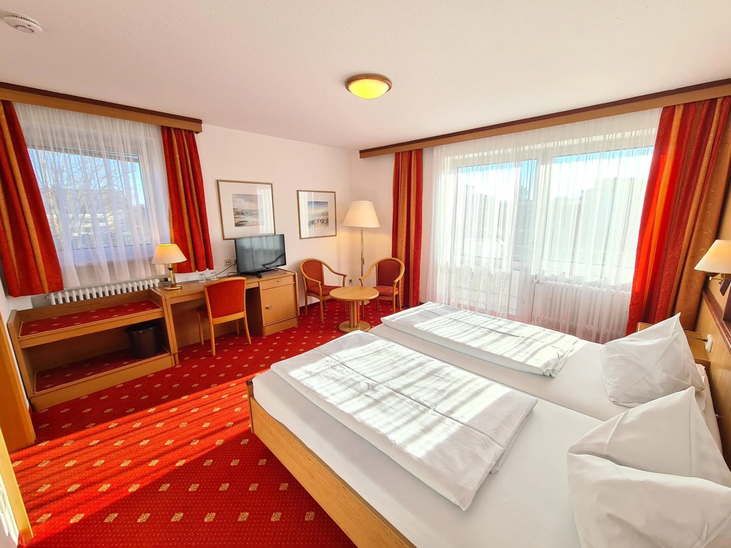 Photo of the whole room, Bed in Thermenhotel Tannenhof - Ihr Wohlfühl-Hotel