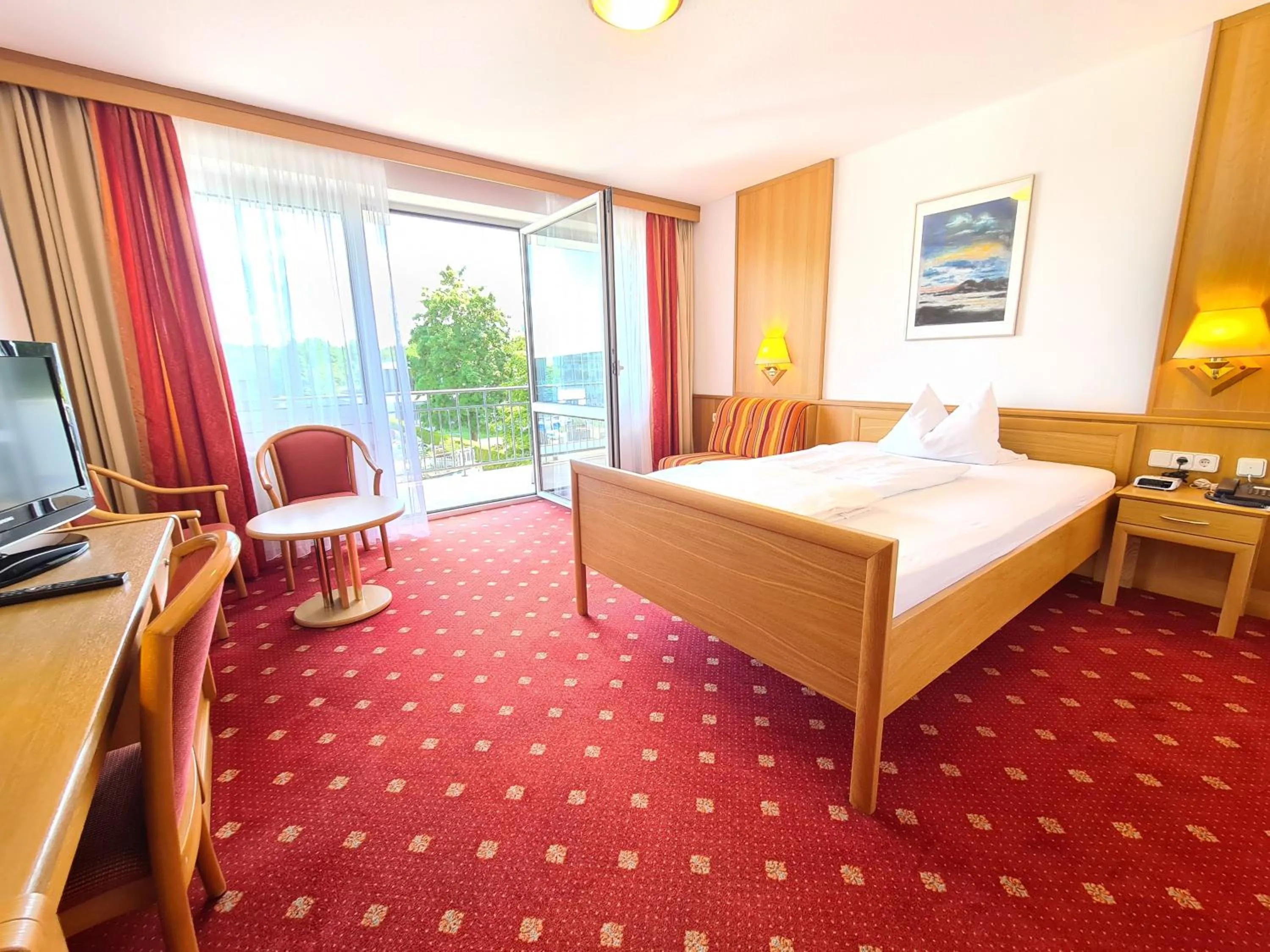 Photo of the whole room, Bed in Thermenhotel Tannenhof - Ihr Wohlfühl-Hotel