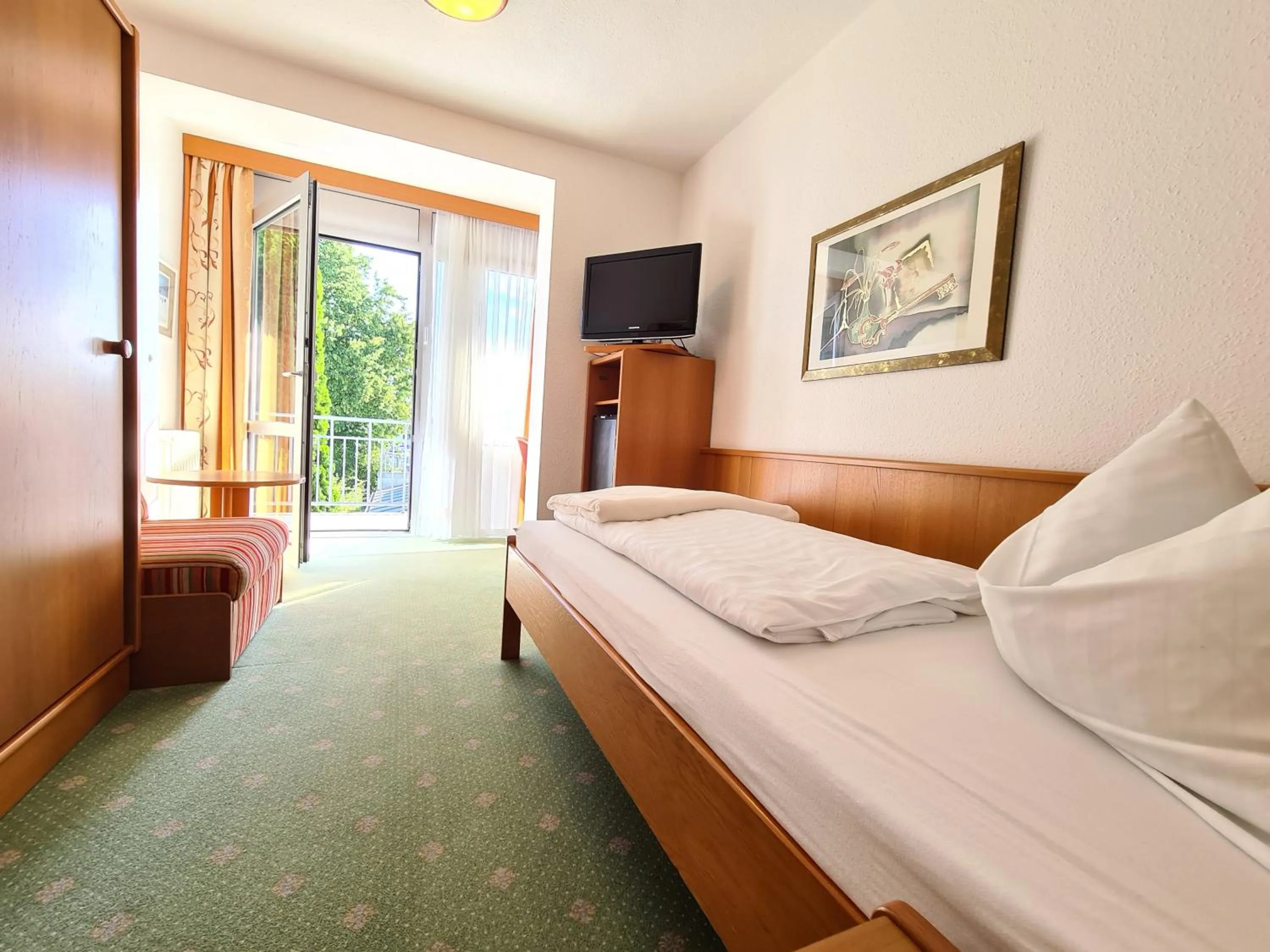 Photo of the whole room, Bed in Thermenhotel Tannenhof - Ihr Wohlfühl-Hotel