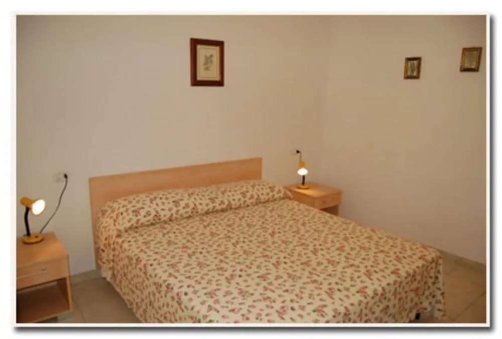 Bedroom, Bed in Appartamenti Villa Miramare