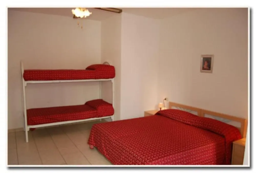 Bedroom, Bed in Appartamenti Villa Miramare