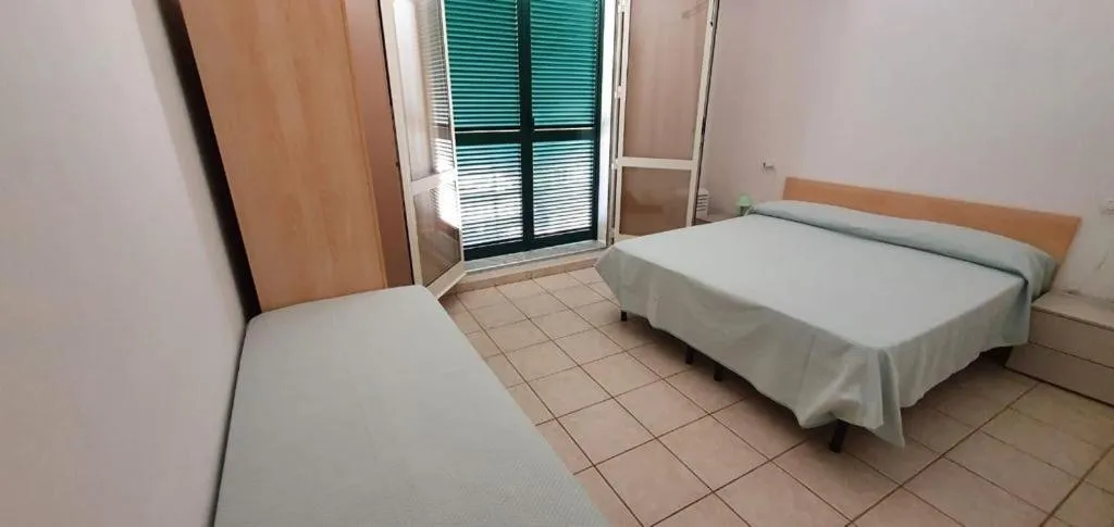 Bedroom, Bed in Appartamenti Villa Miramare