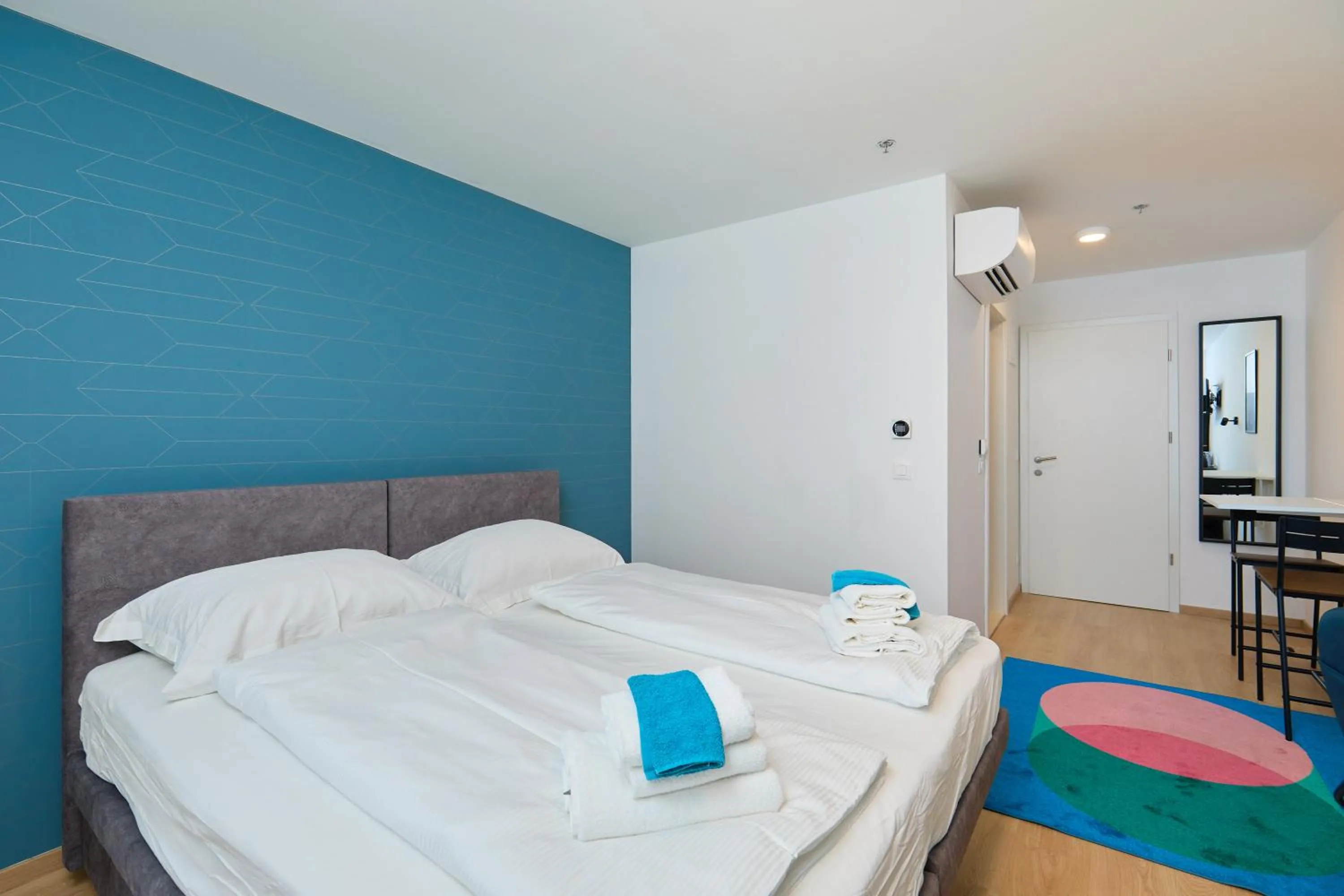 Bed in DOMINIUM CITY SUITES