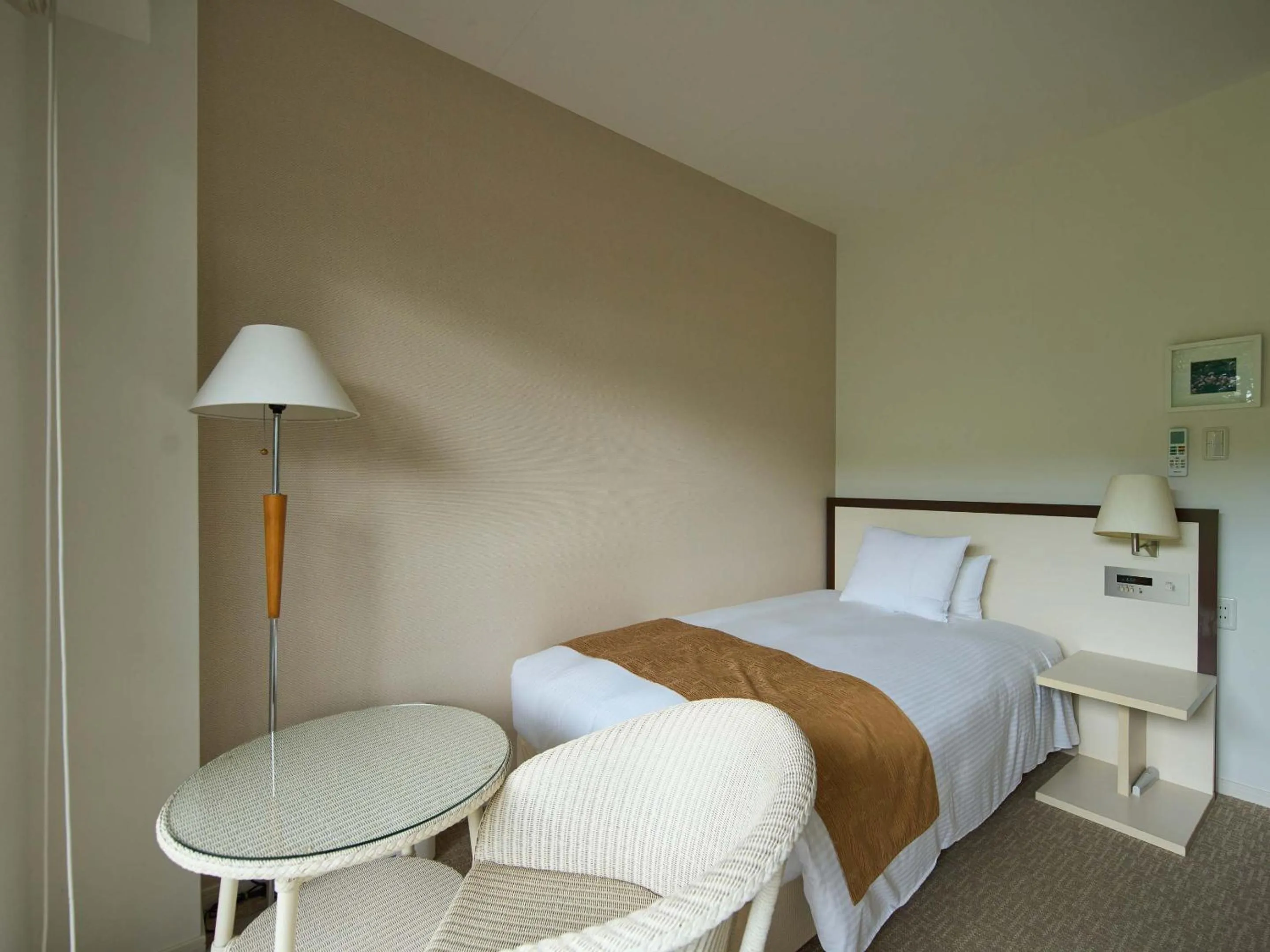 Bed in Hotel Holistic Resort Wakayama