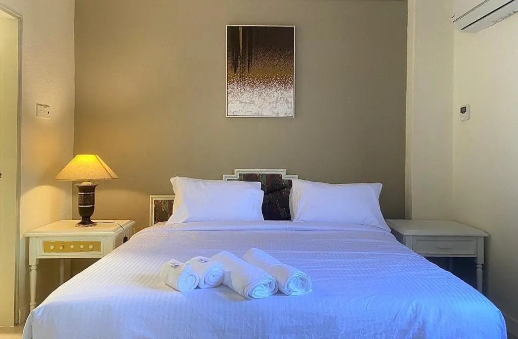 Bed in SWISS AVENUE HOTEL