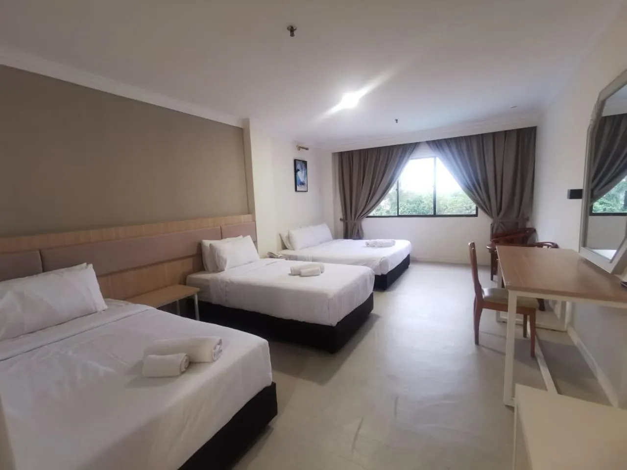 Bed in SWISS AVENUE HOTEL