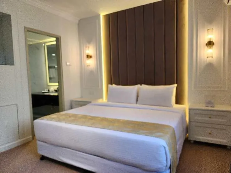 Bed in SWISS AVENUE HOTEL