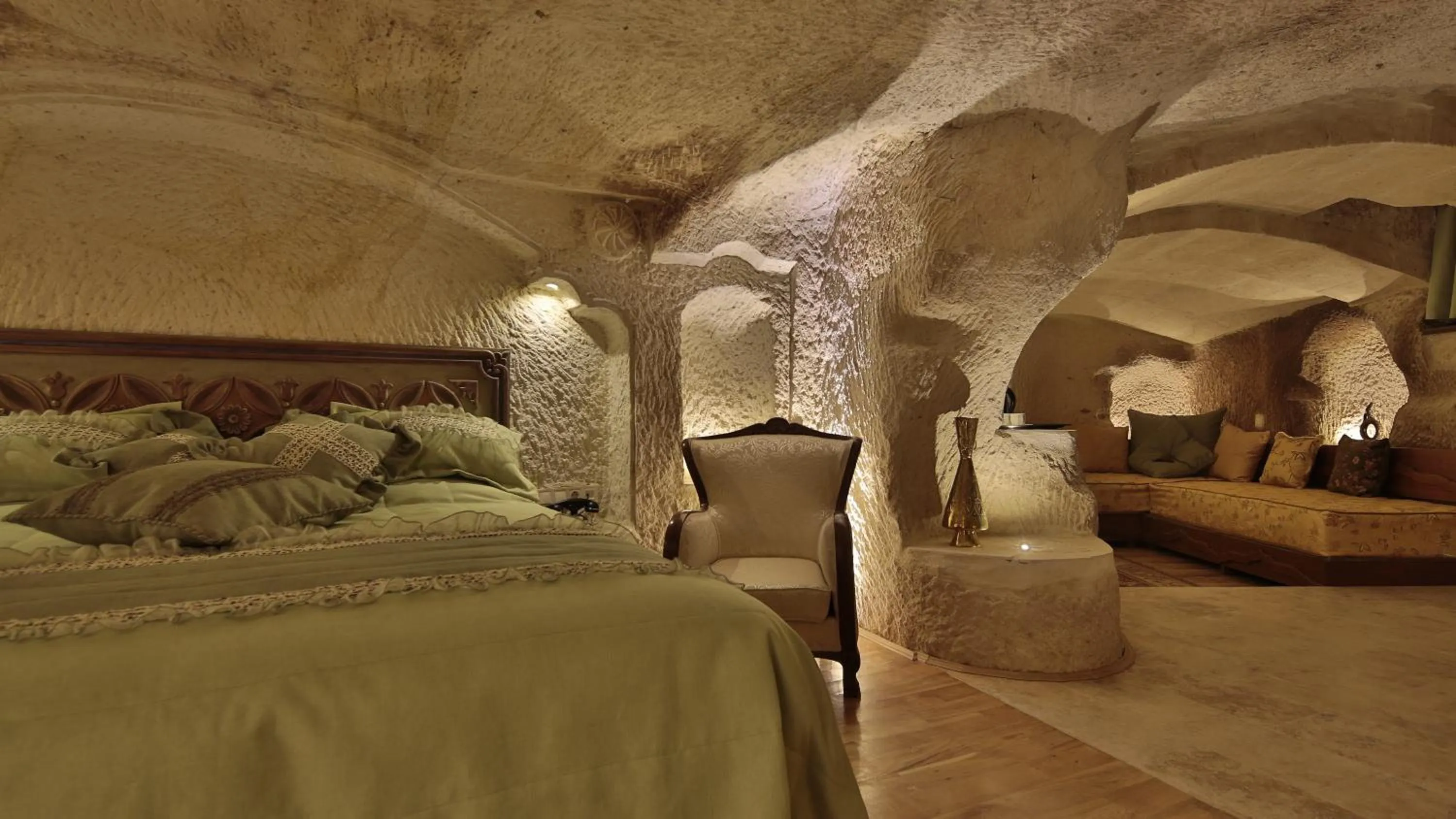 Living room, Bed in Golden Cave Suites