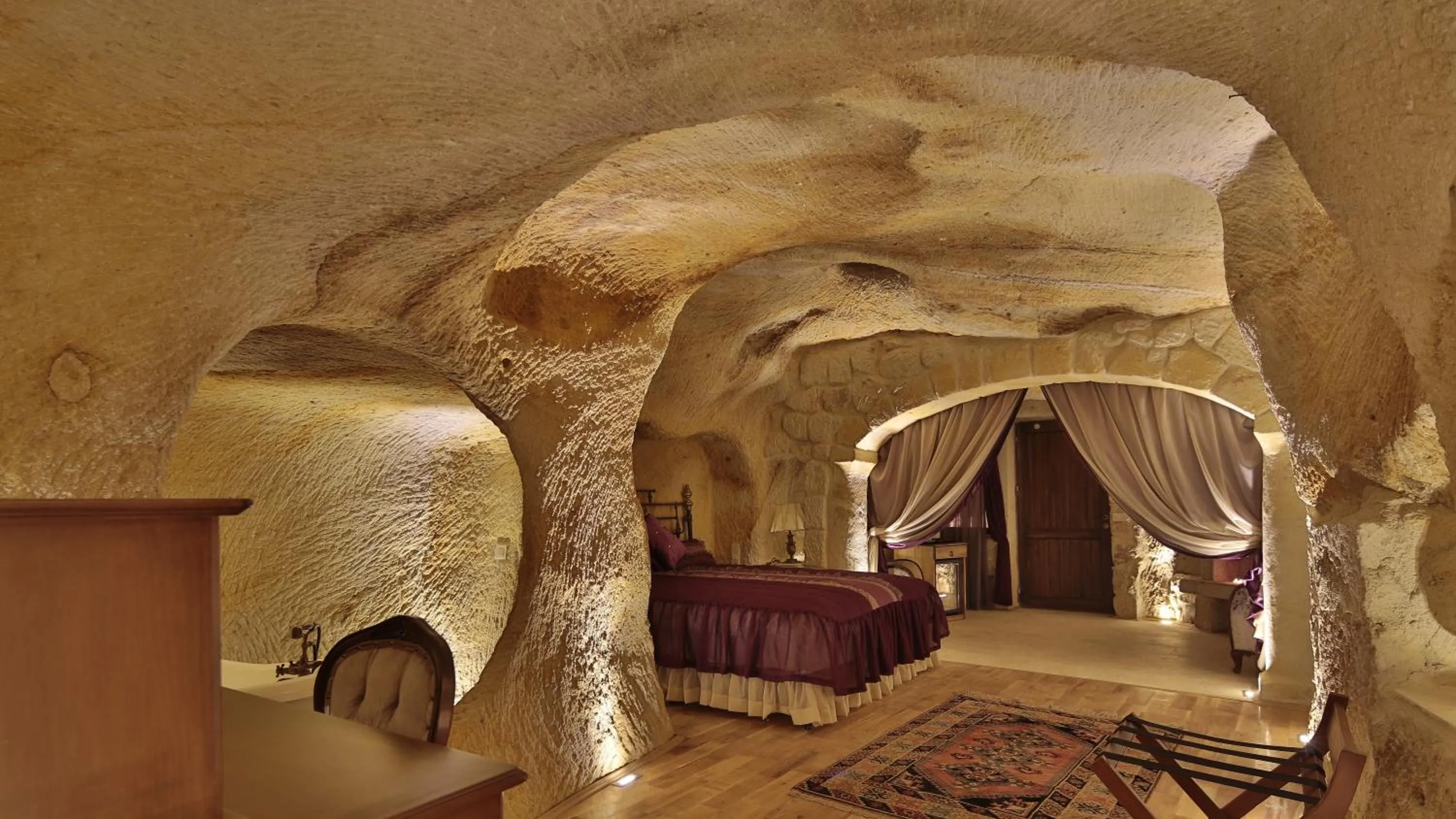 Living room, Bed in Golden Cave Suites