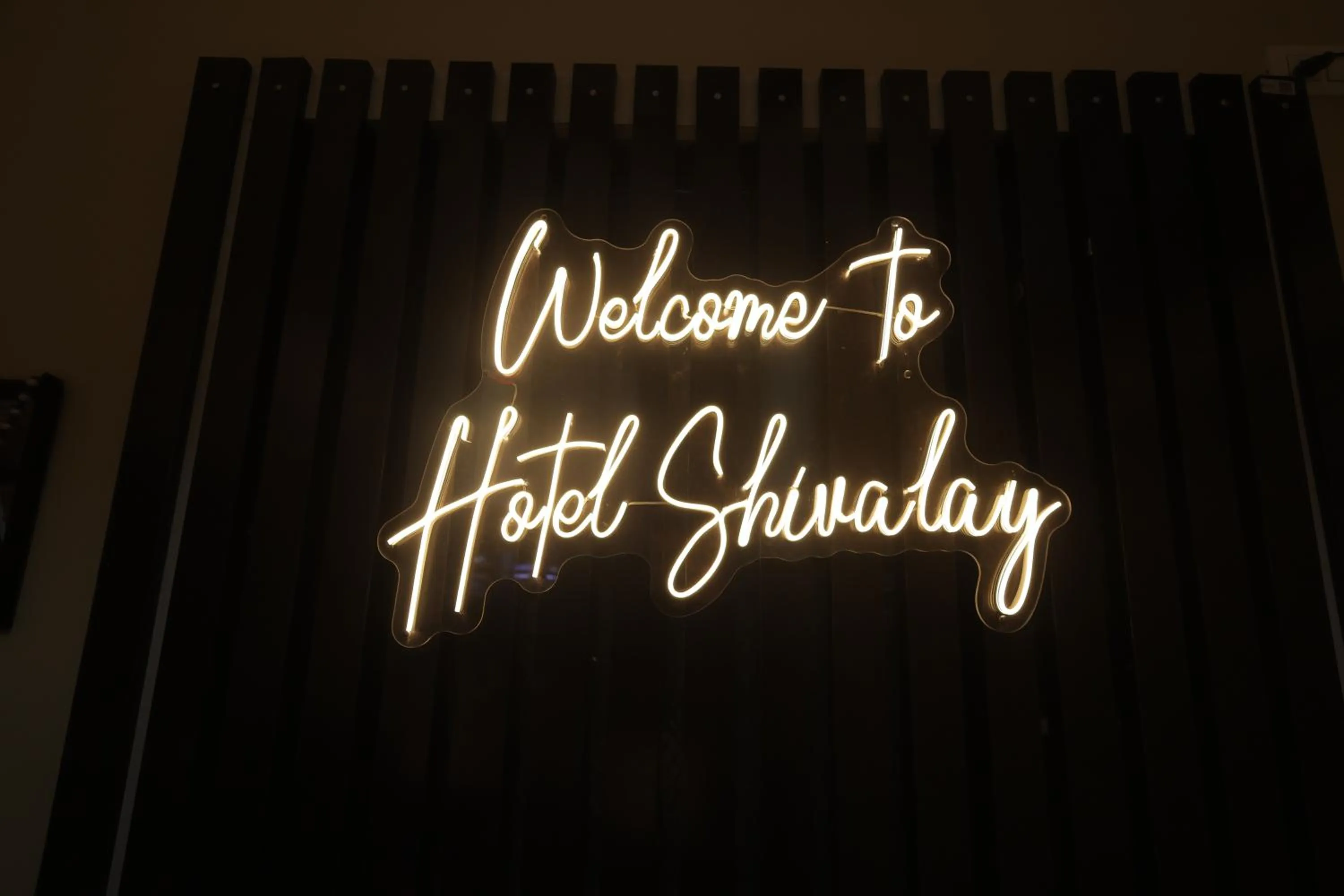 Property logo or sign in Hotel Shivalay Palace