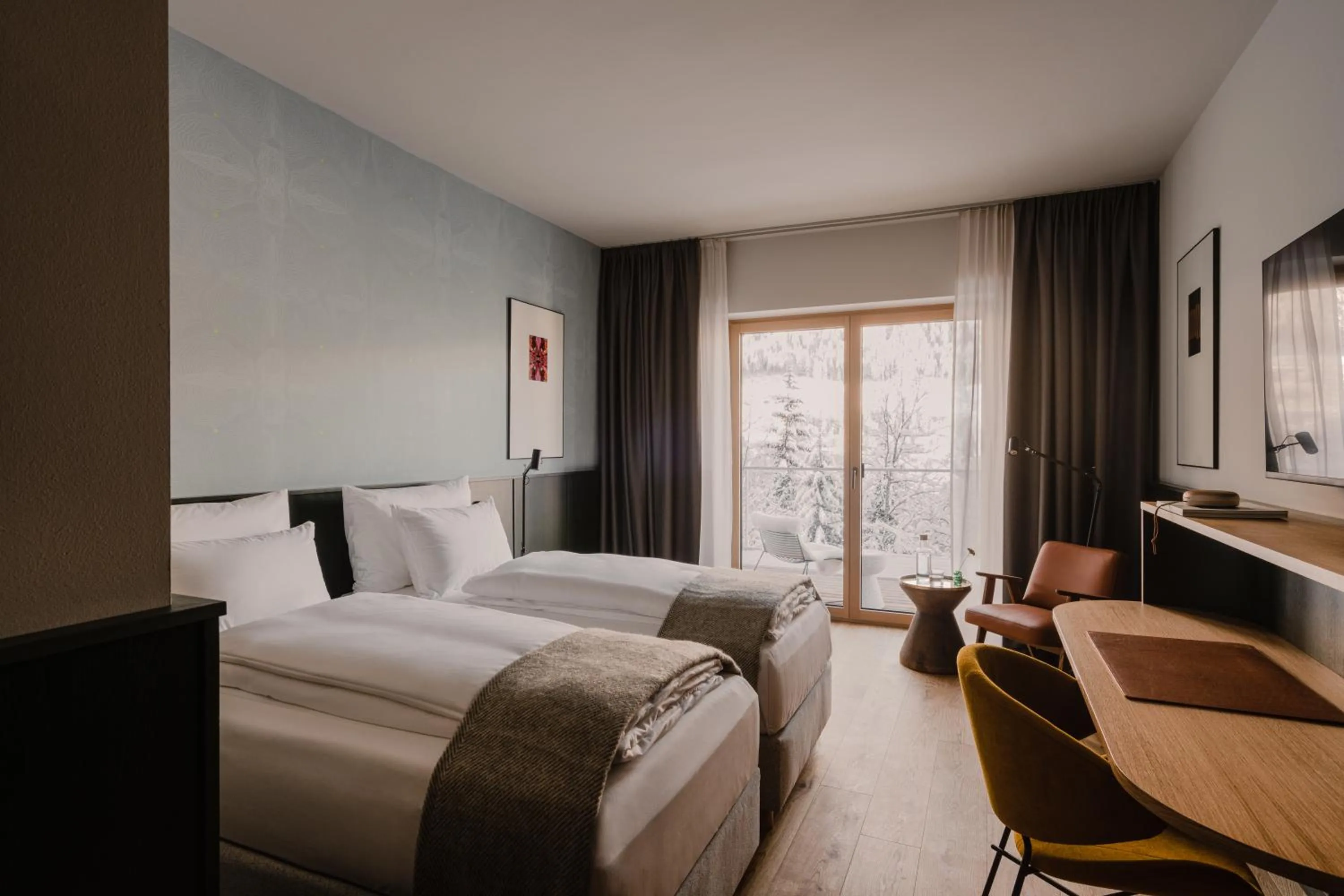 Photo of the whole room, Bed in The Comodo Bad Gastein, a Member of Design Hotels