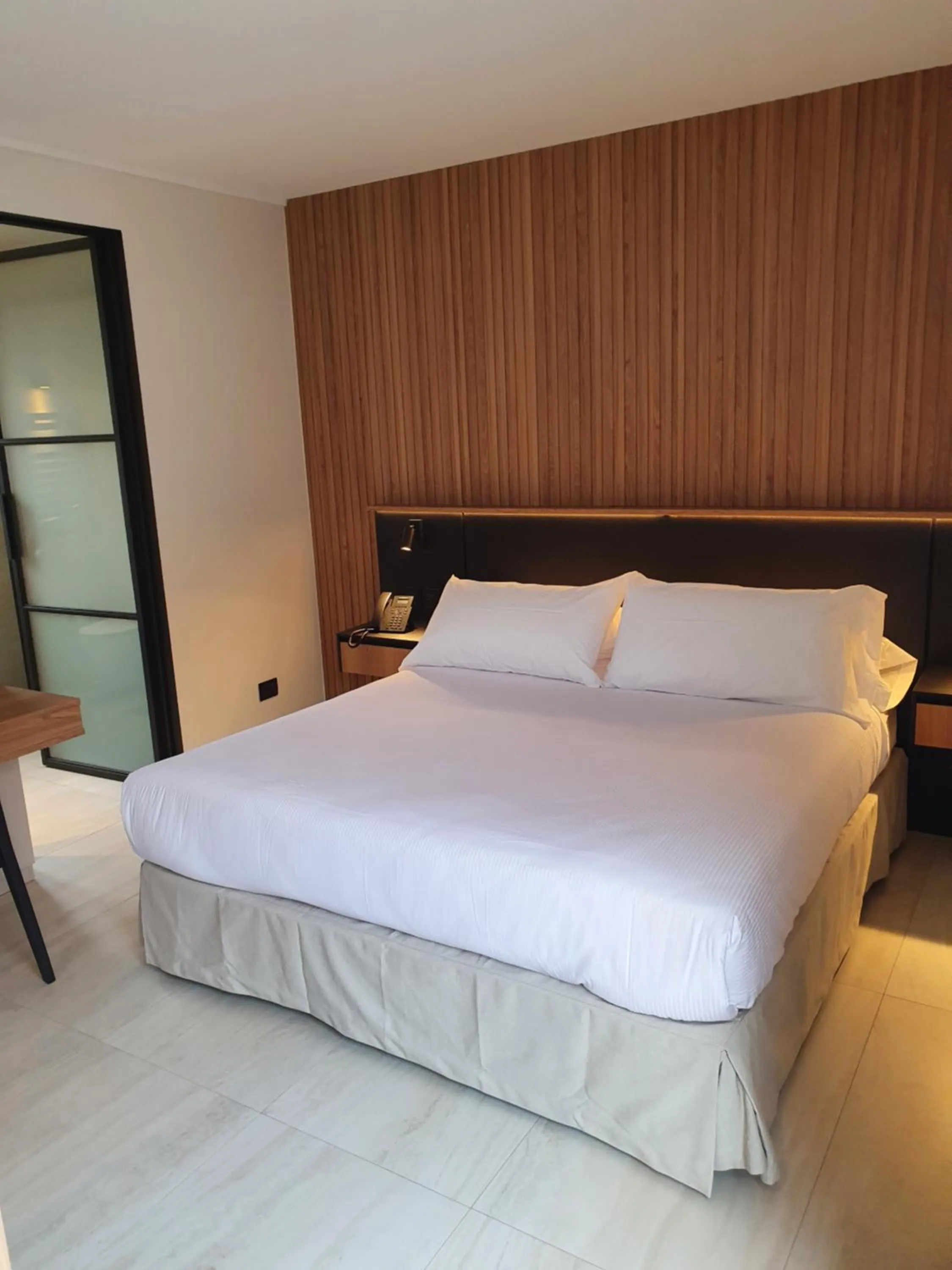 Bed in Lastarria Hotel