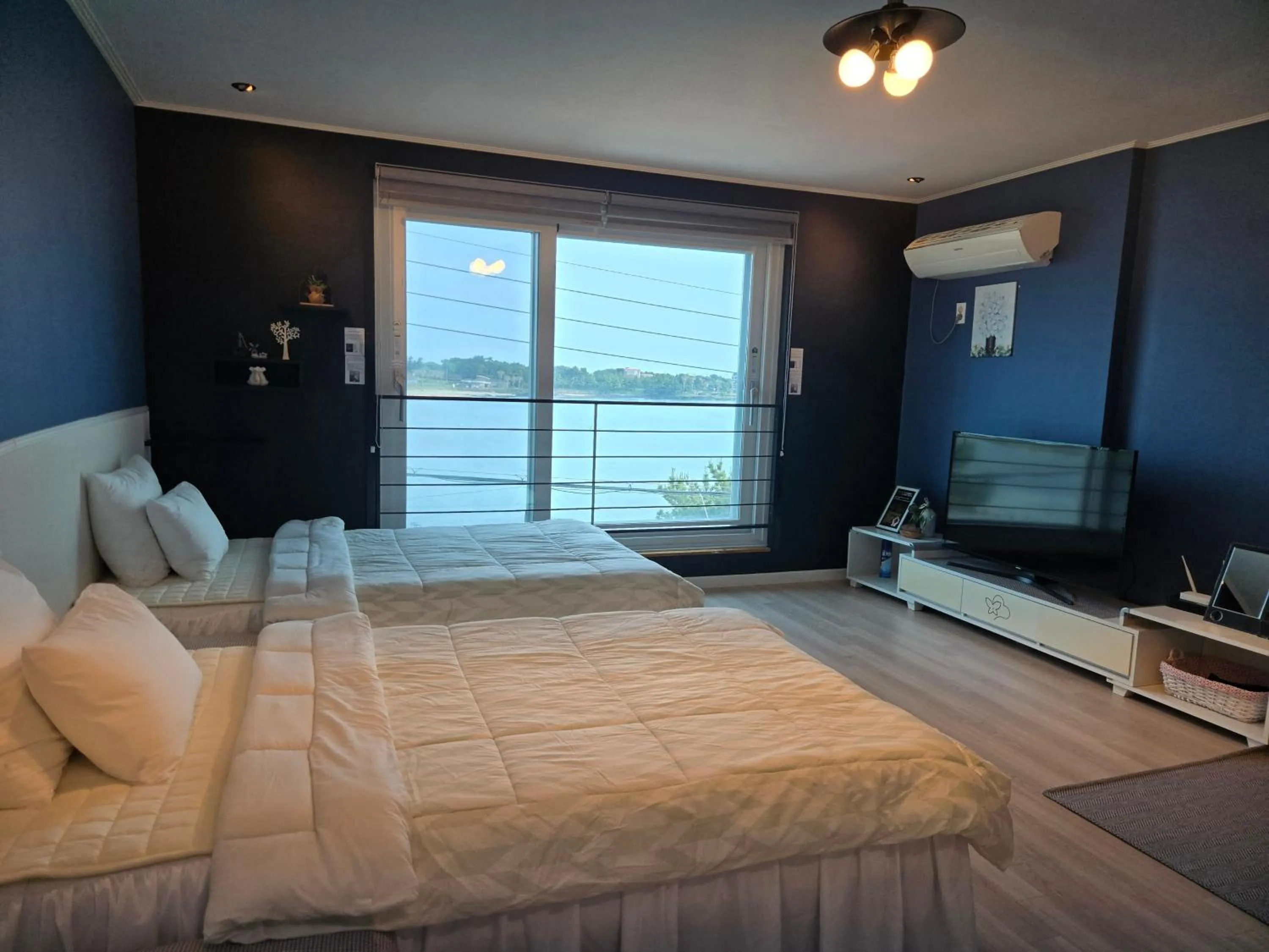 Bed in Jeju Gaviota Pension