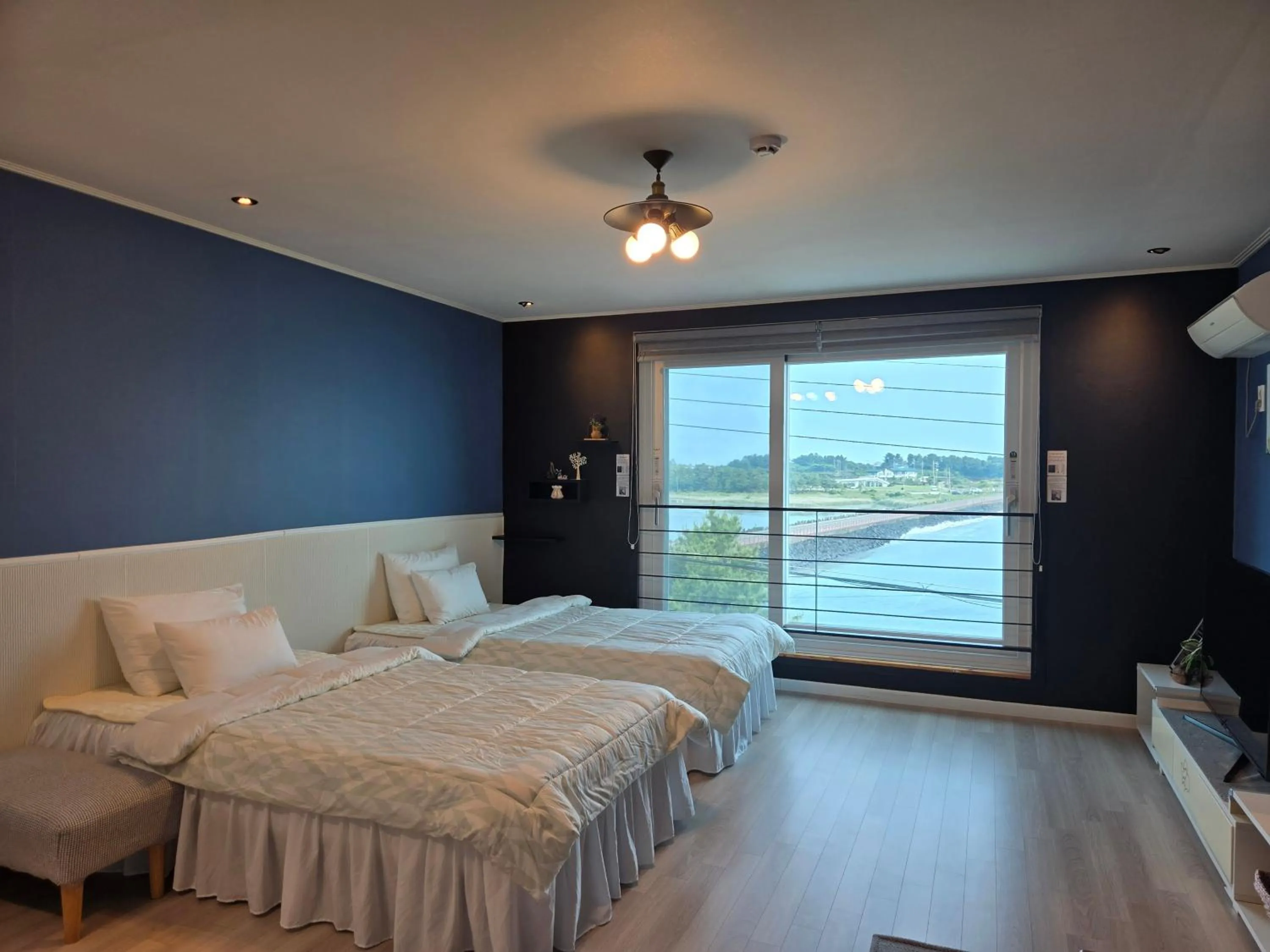 Bed in Jeju Gaviota Pension