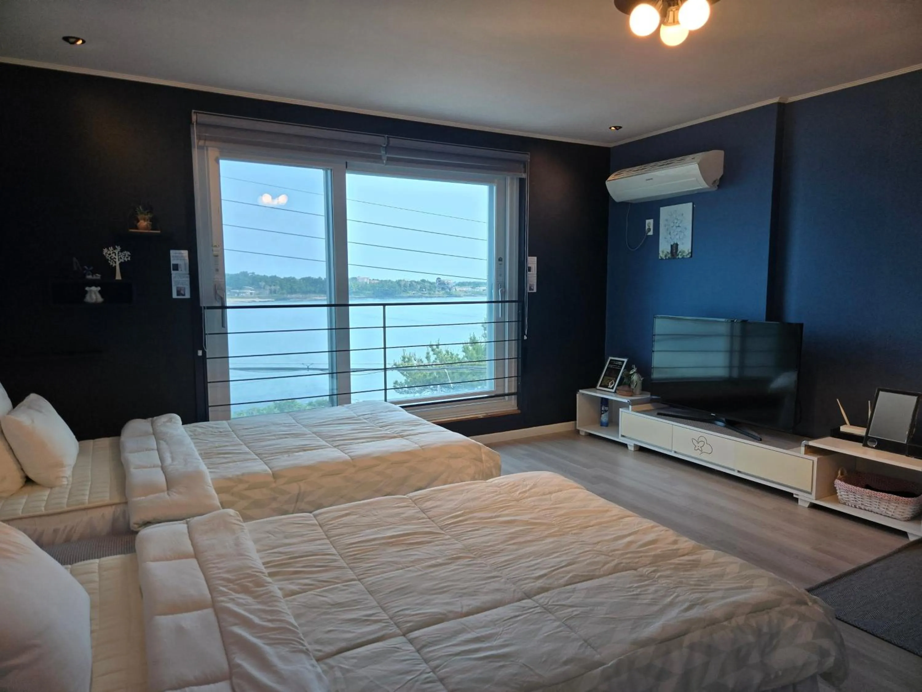 Bed in Jeju Gaviota Pension