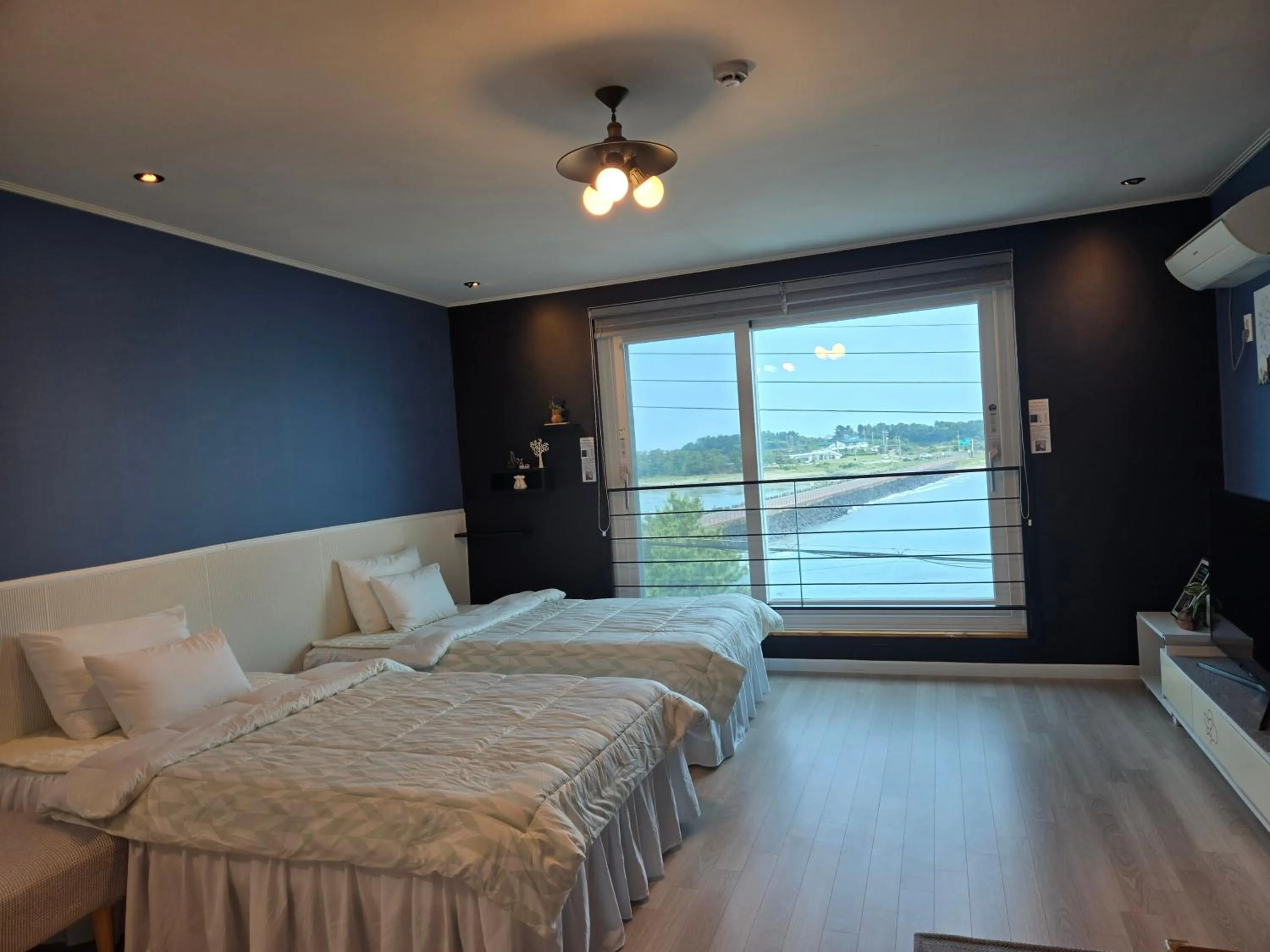 Bed in Jeju Gaviota Pension