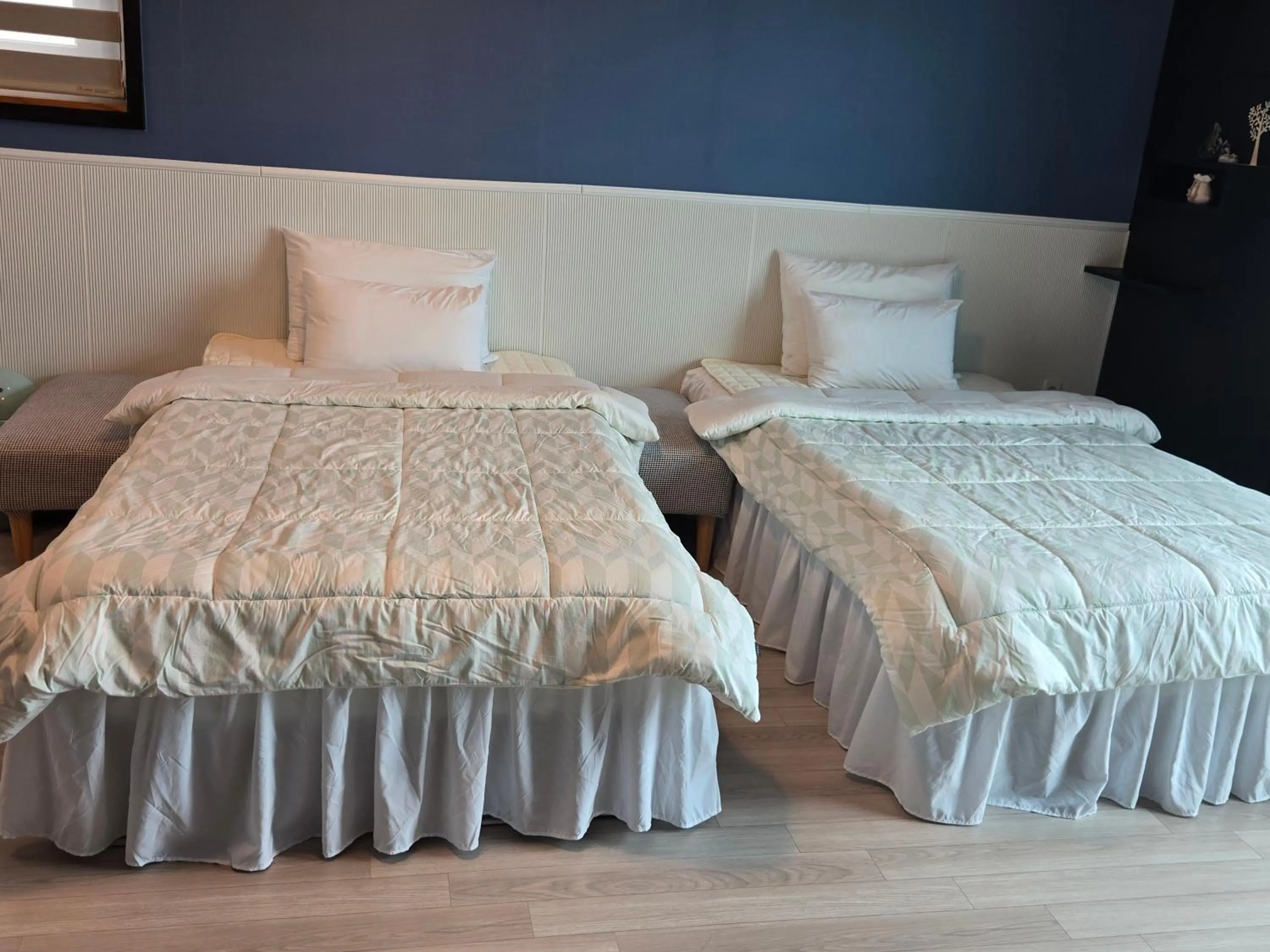 Bed in Jeju Gaviota Pension