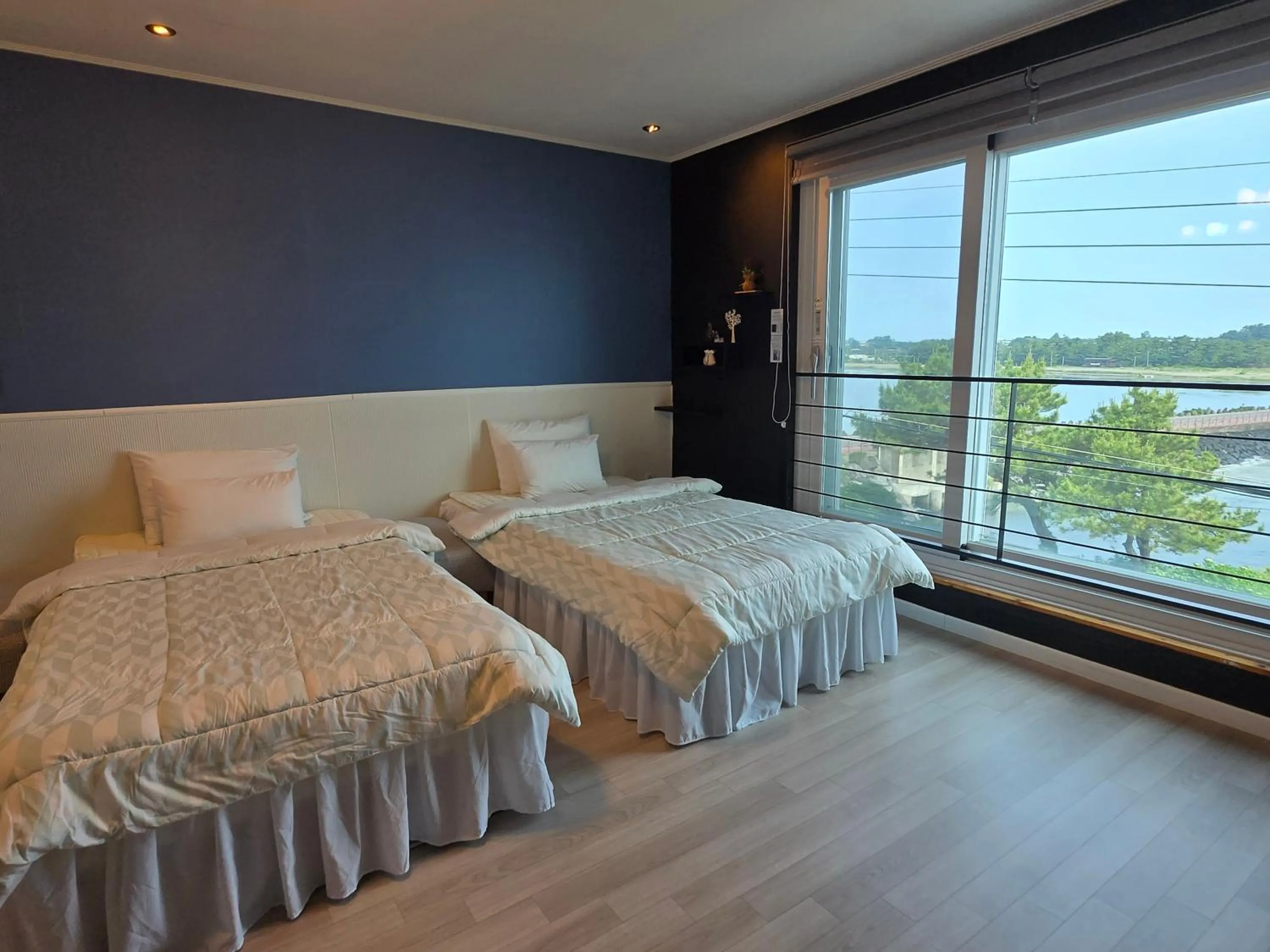 Bed in Jeju Gaviota Pension