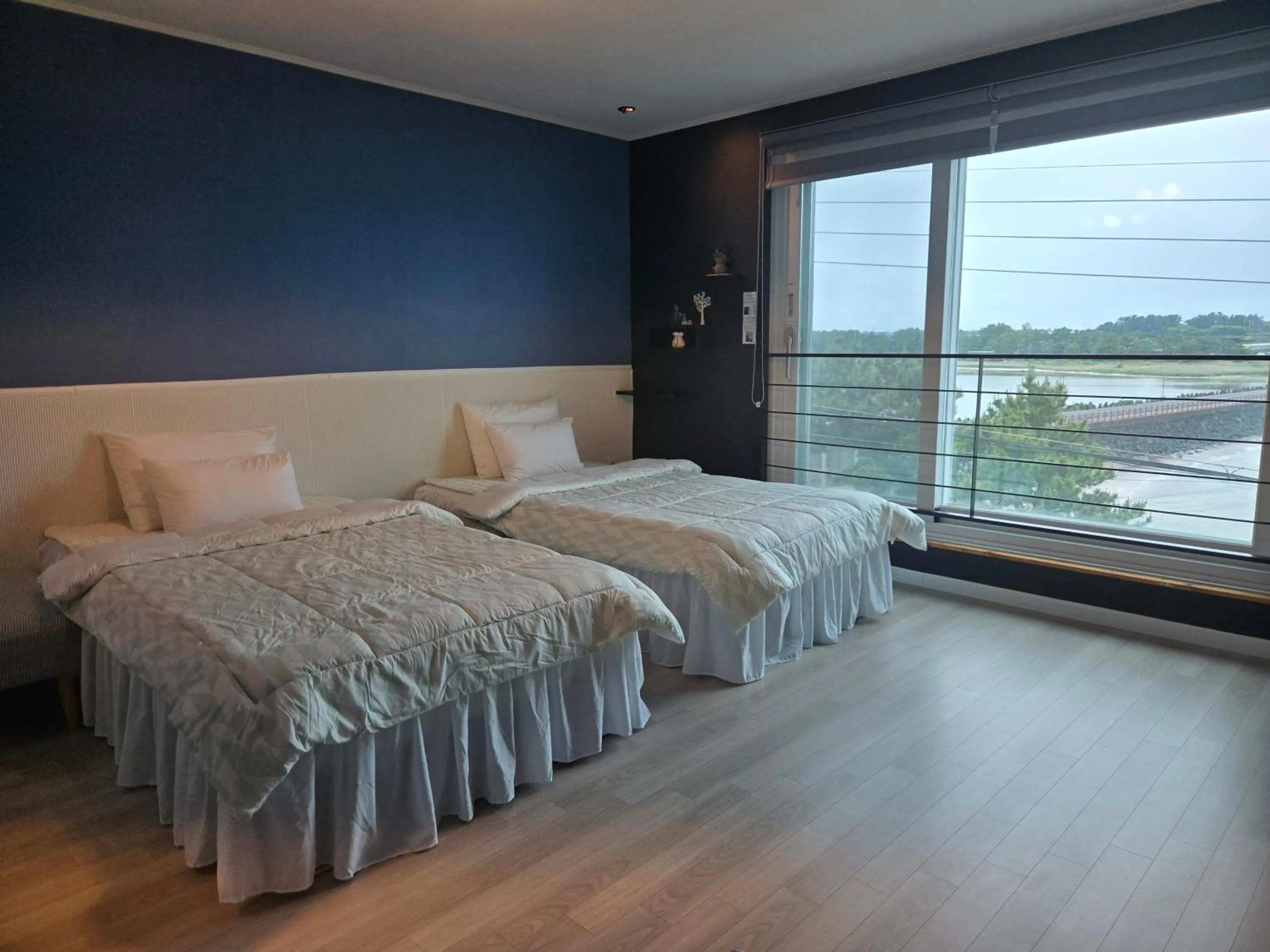 Bed in Jeju Gaviota Pension