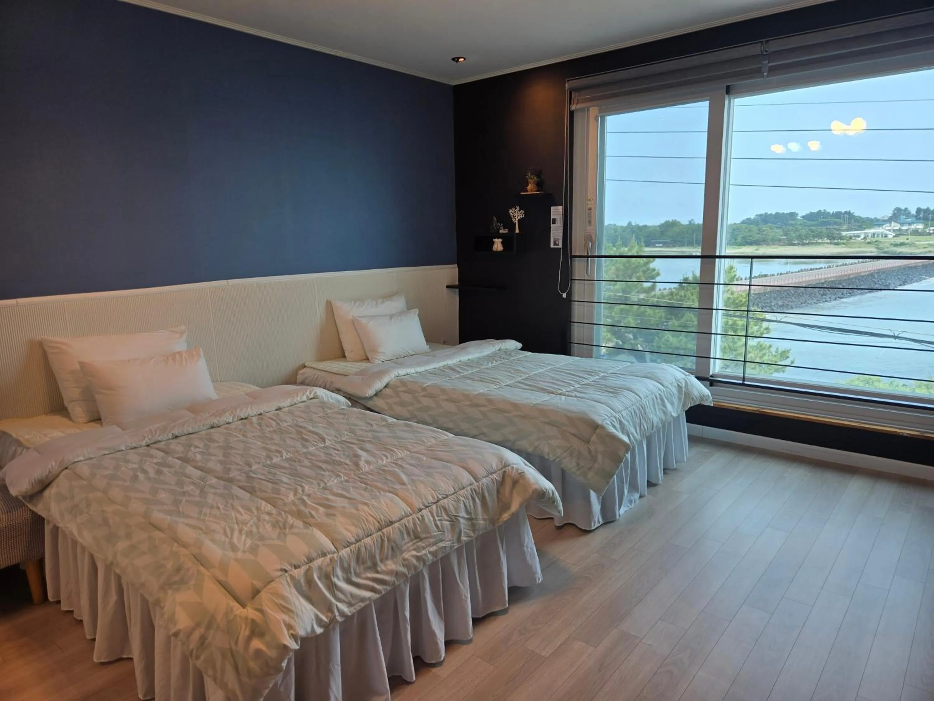 Bed in Jeju Gaviota Pension