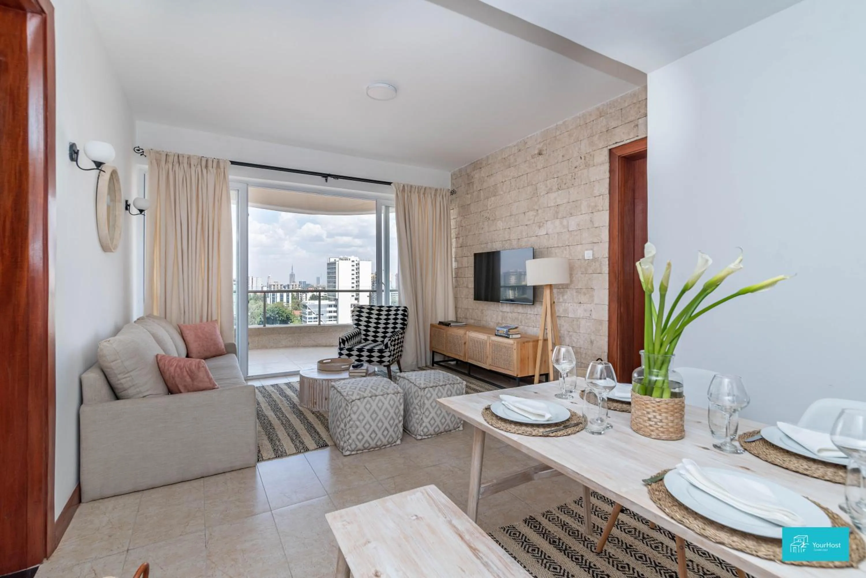 Communal lounge/ TV room in Imagine Luxe Bohemian by YourHost