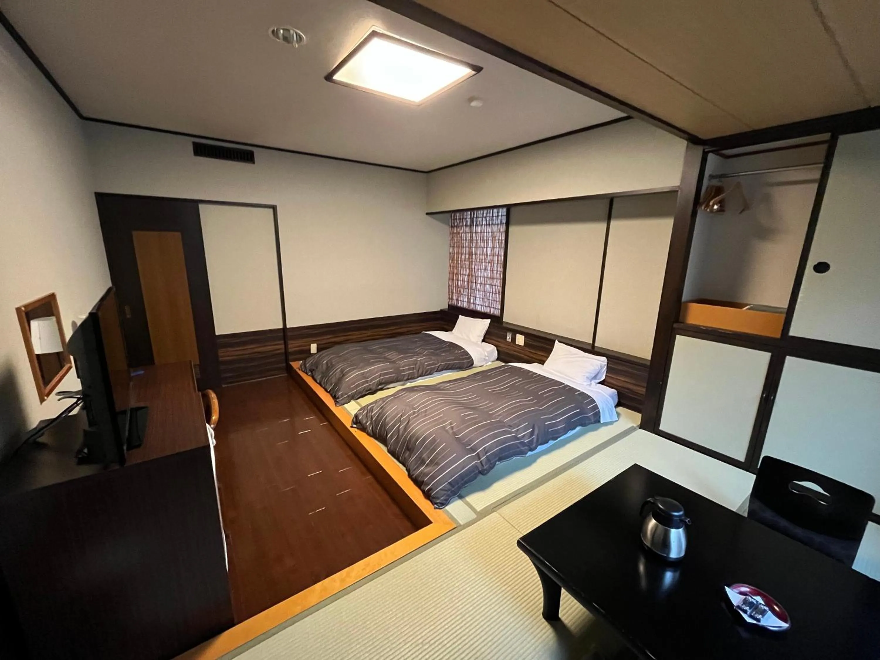 Bed in Takamiya Hotel Lucent