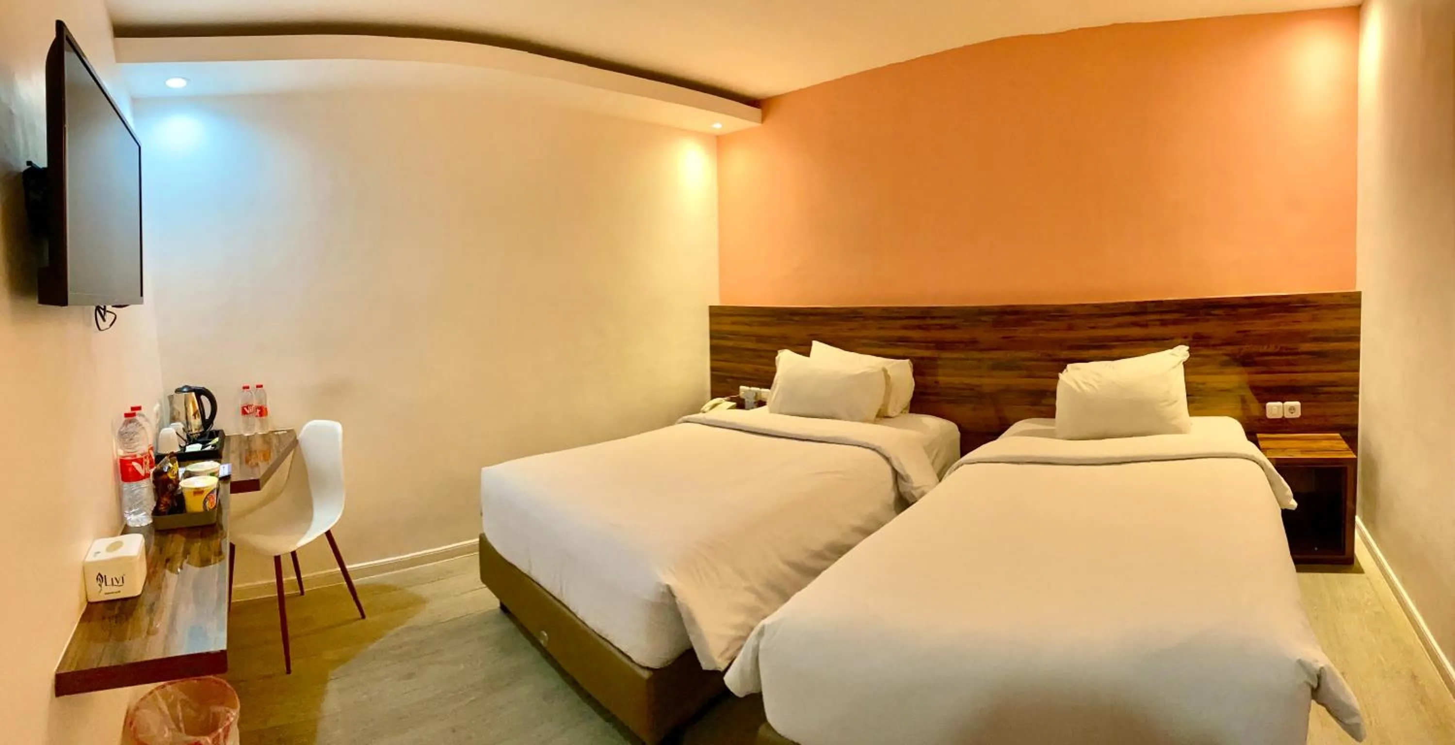 Bed in Rid's Hotel Palembang