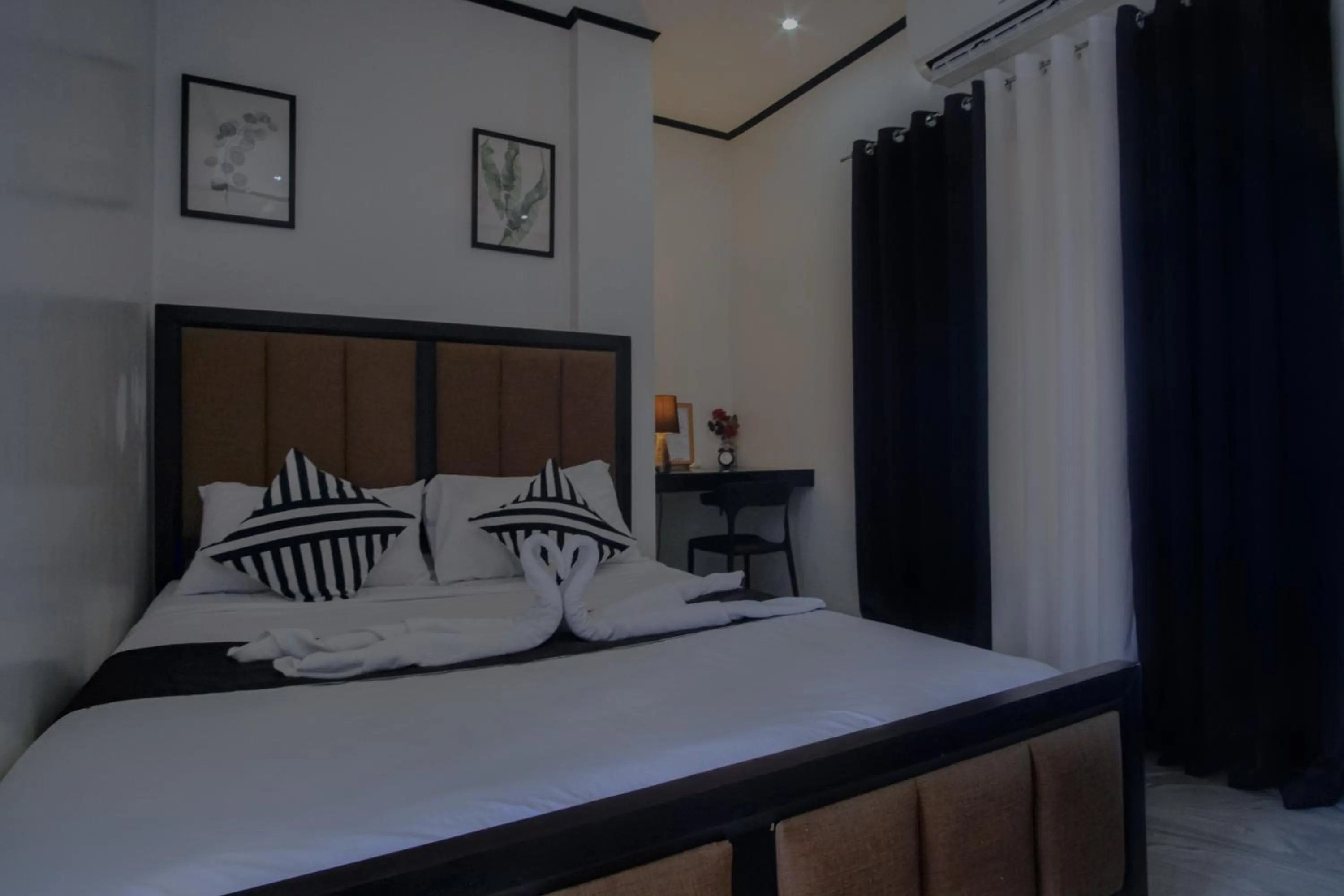 Bed in The Palms Resort & Bar