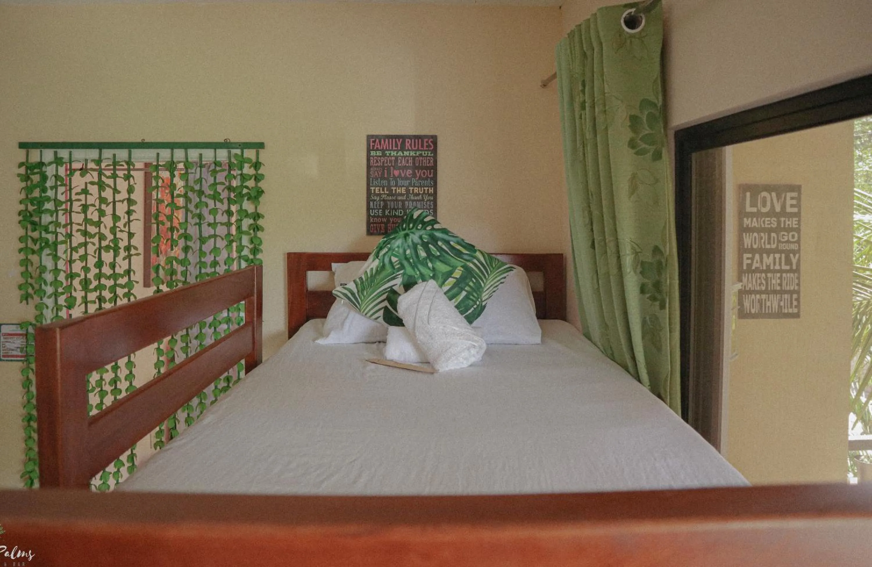 Bed in The Palms Resort & Bar