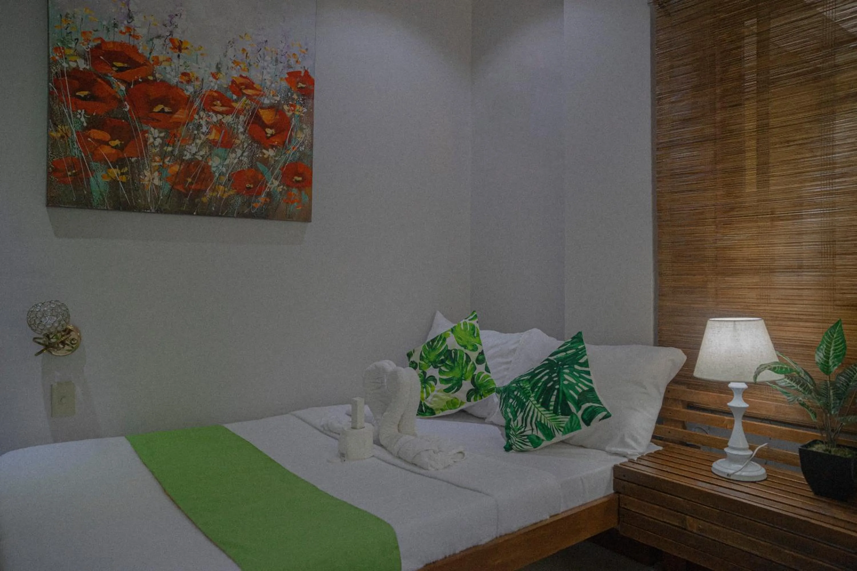 Bed in The Palms Resort & Bar