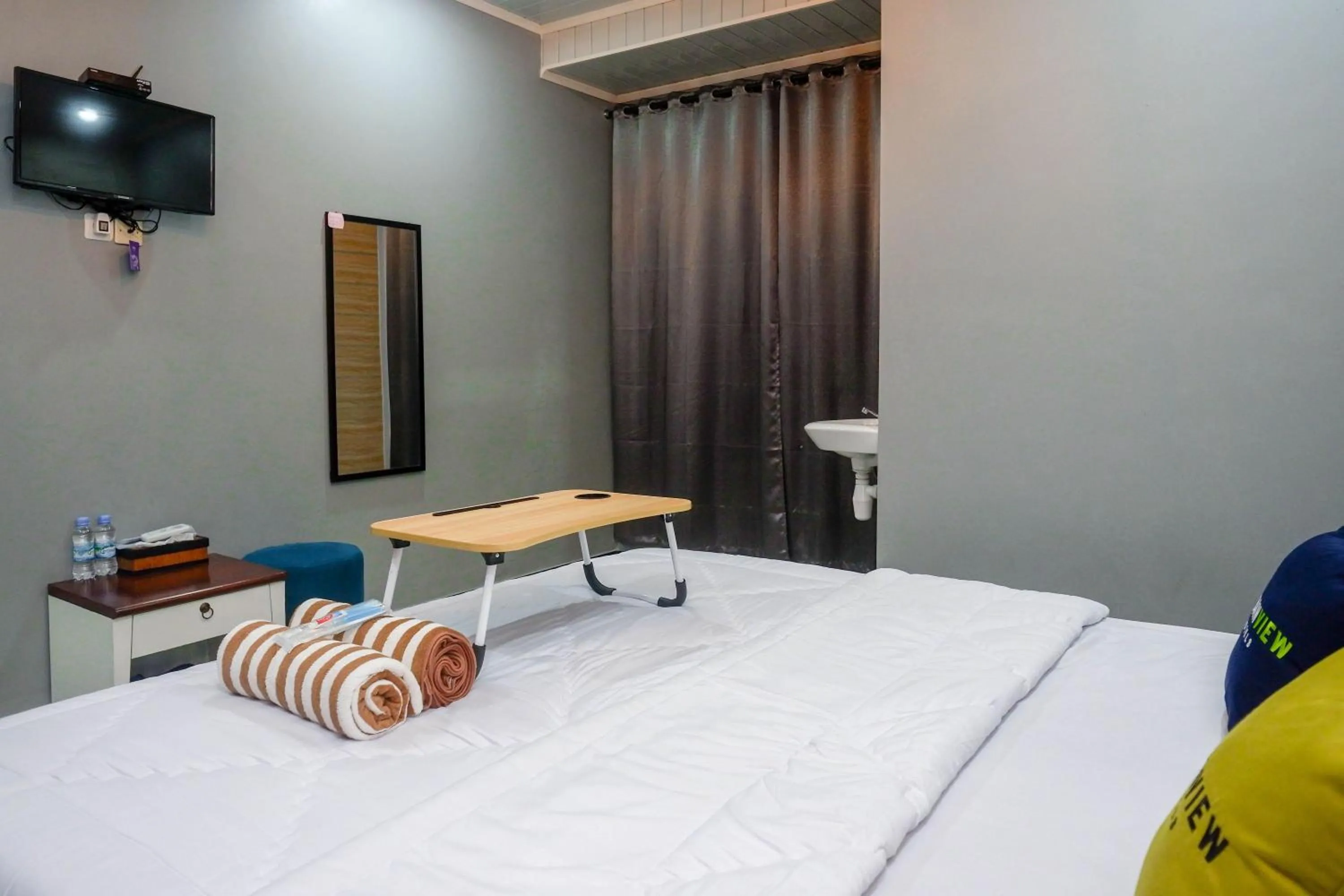 Photo of the whole room, Bed in Urbanview Hotel Umbrella Dieng by RedDoorz