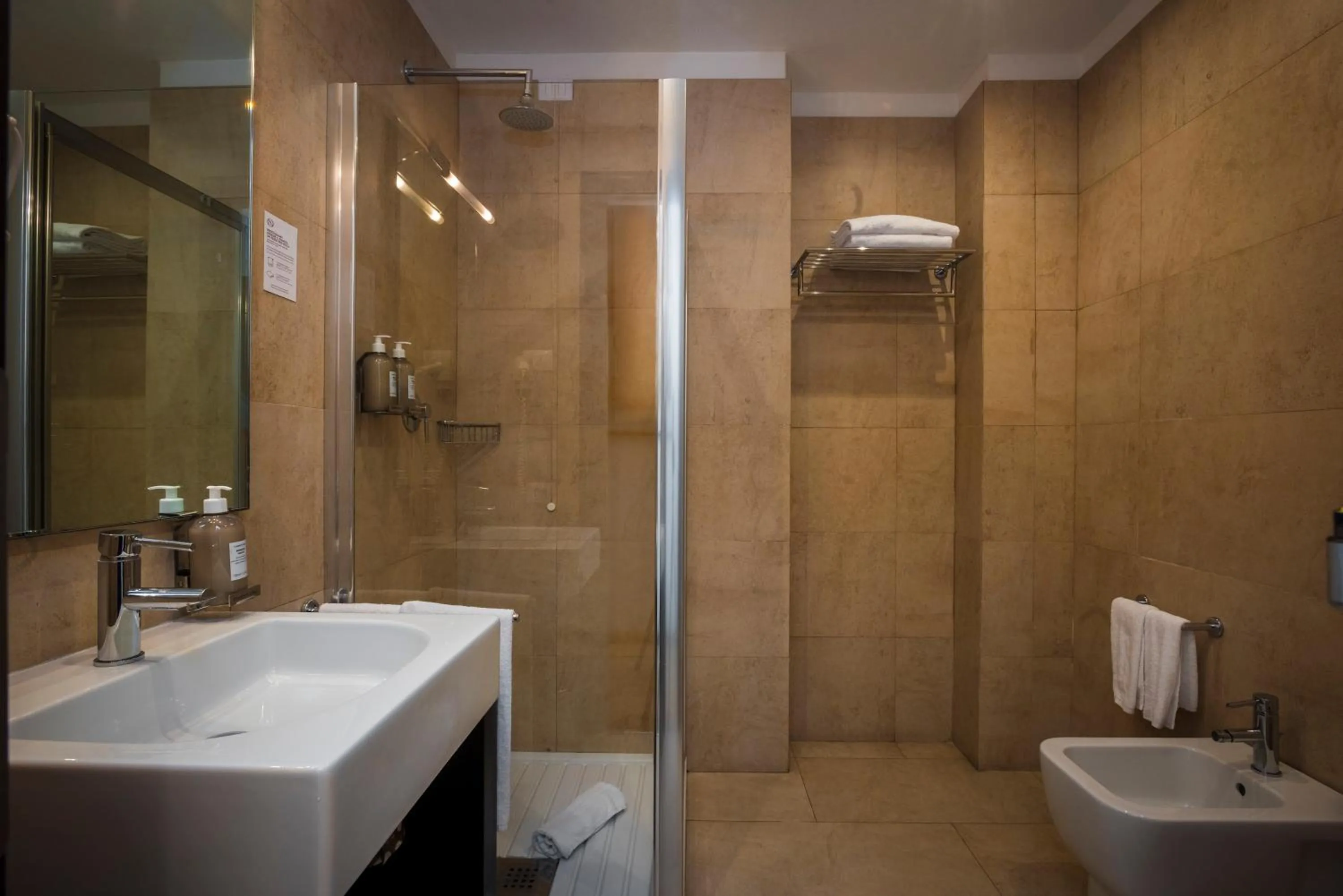 Bathroom in Sardegna Hotel - Suites & Restaurant
