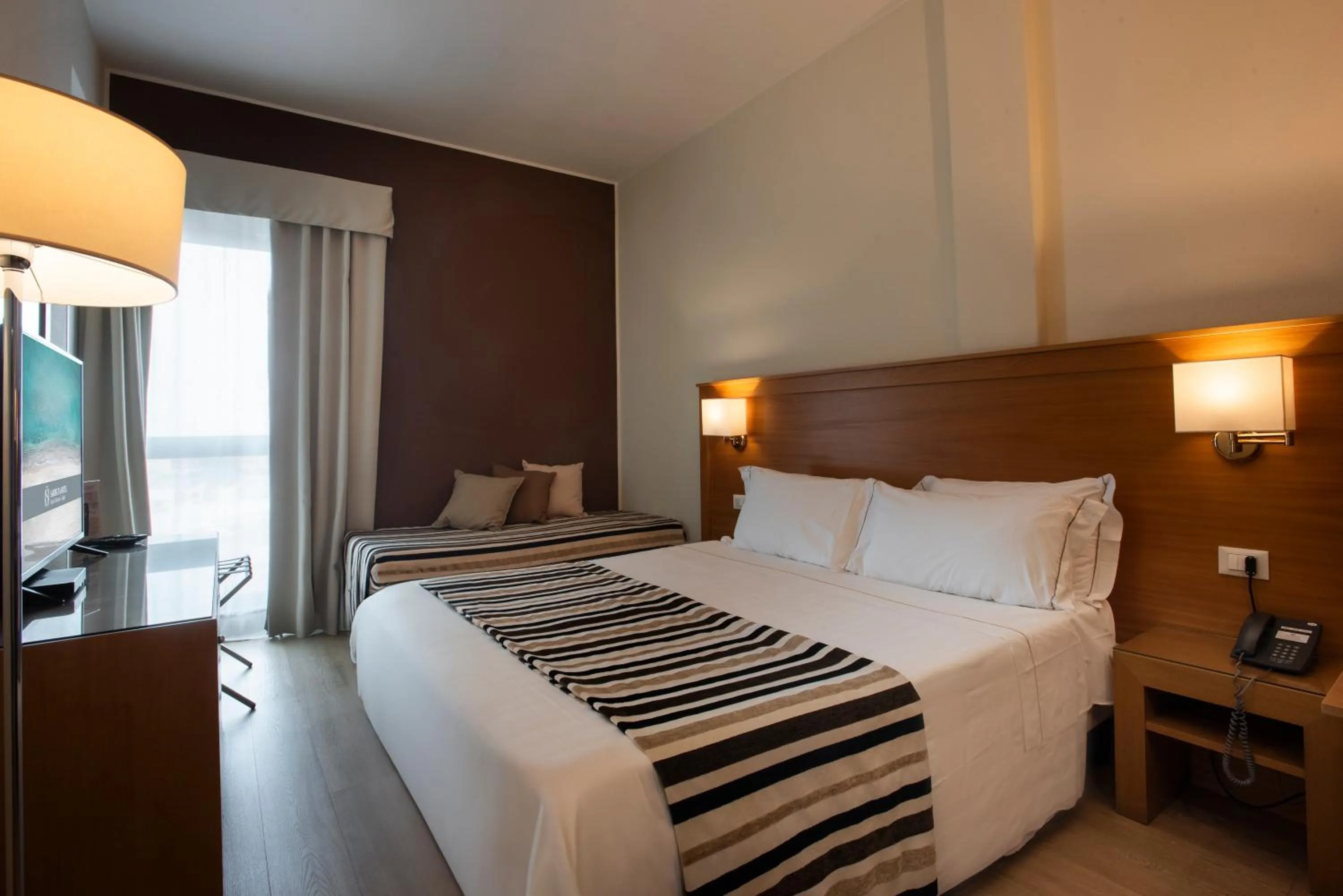 Bed in Sardegna Hotel - Suites & Restaurant