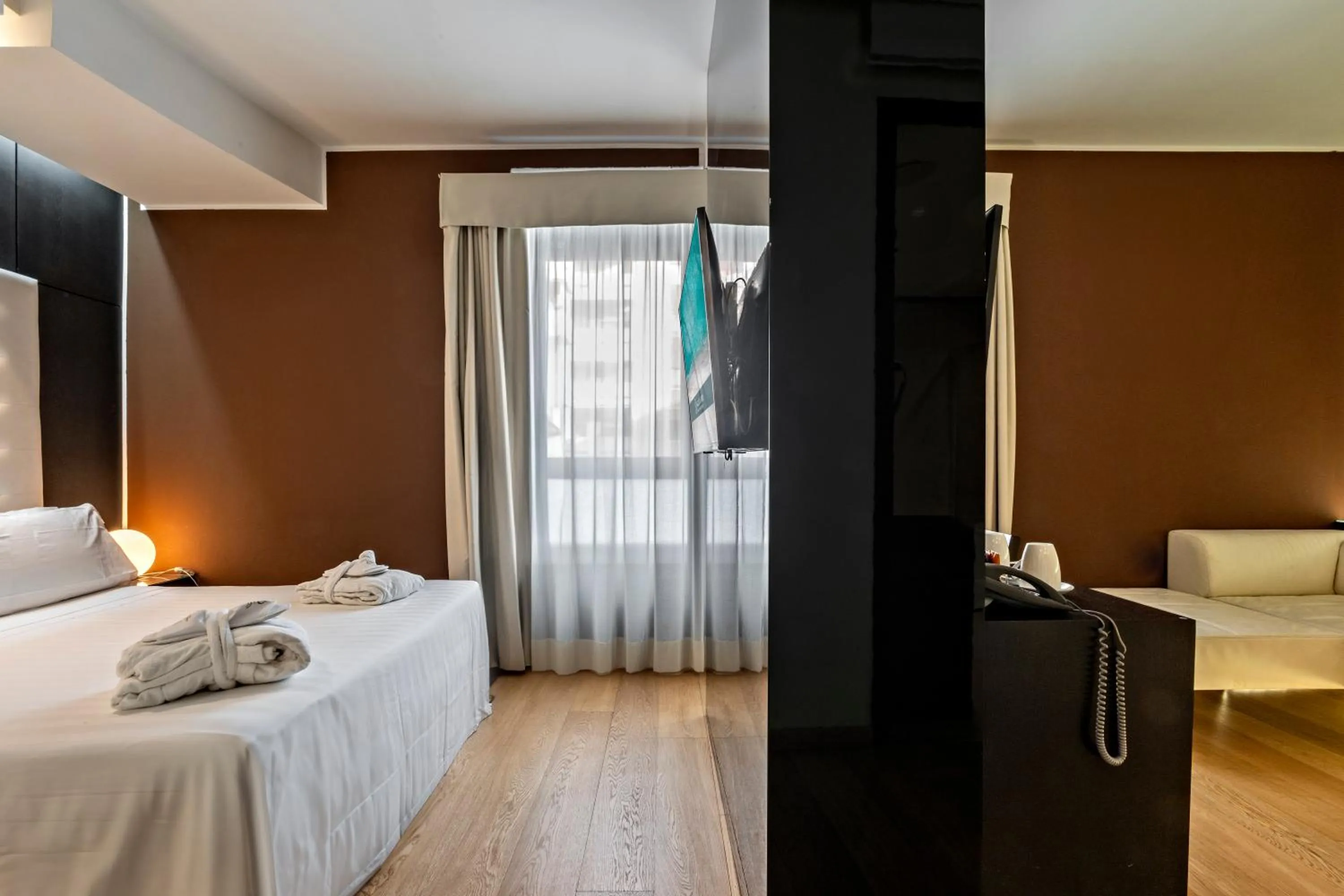 Bed in Sardegna Hotel - Suites & Restaurant