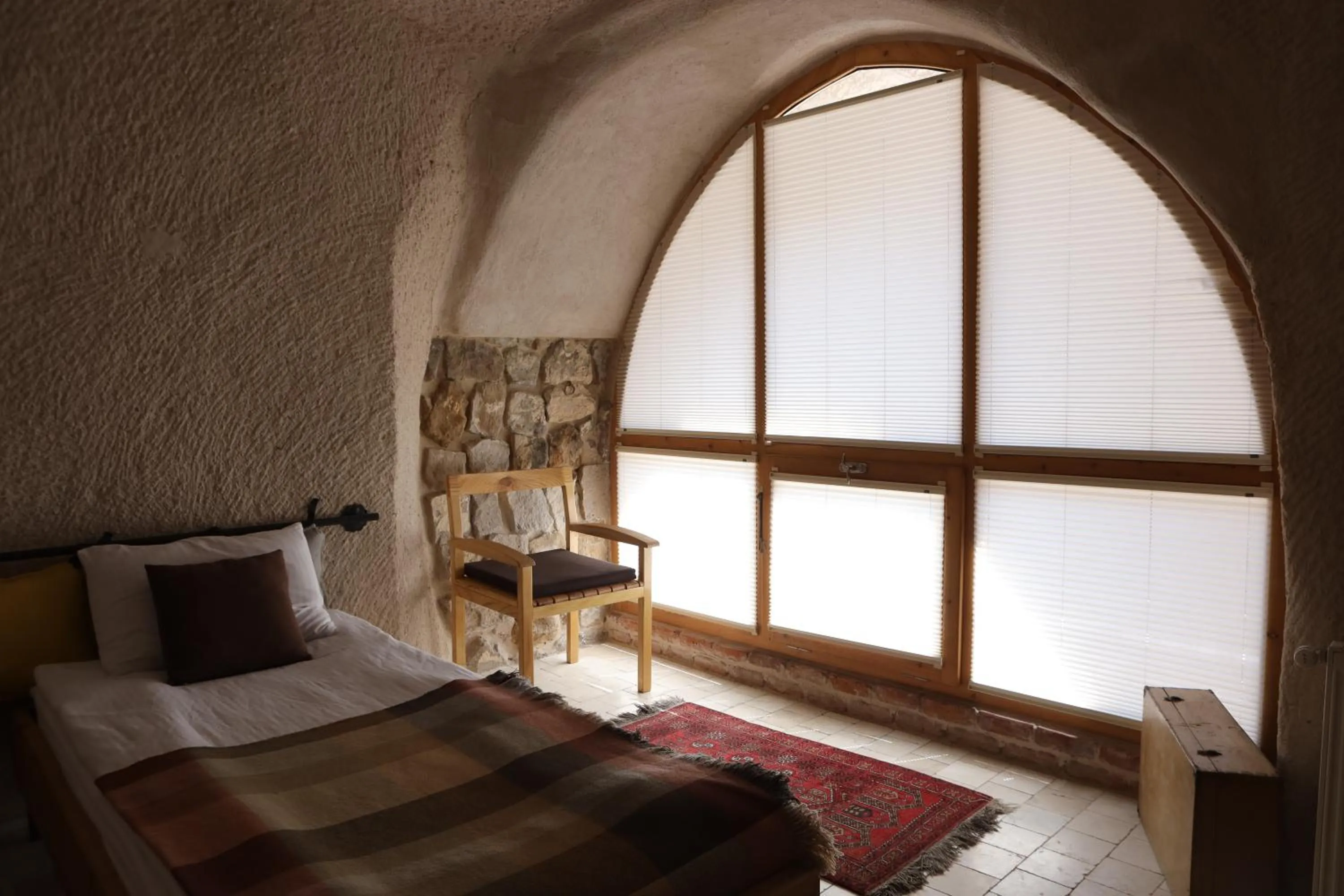 Bed in Pinhan Cave Suites