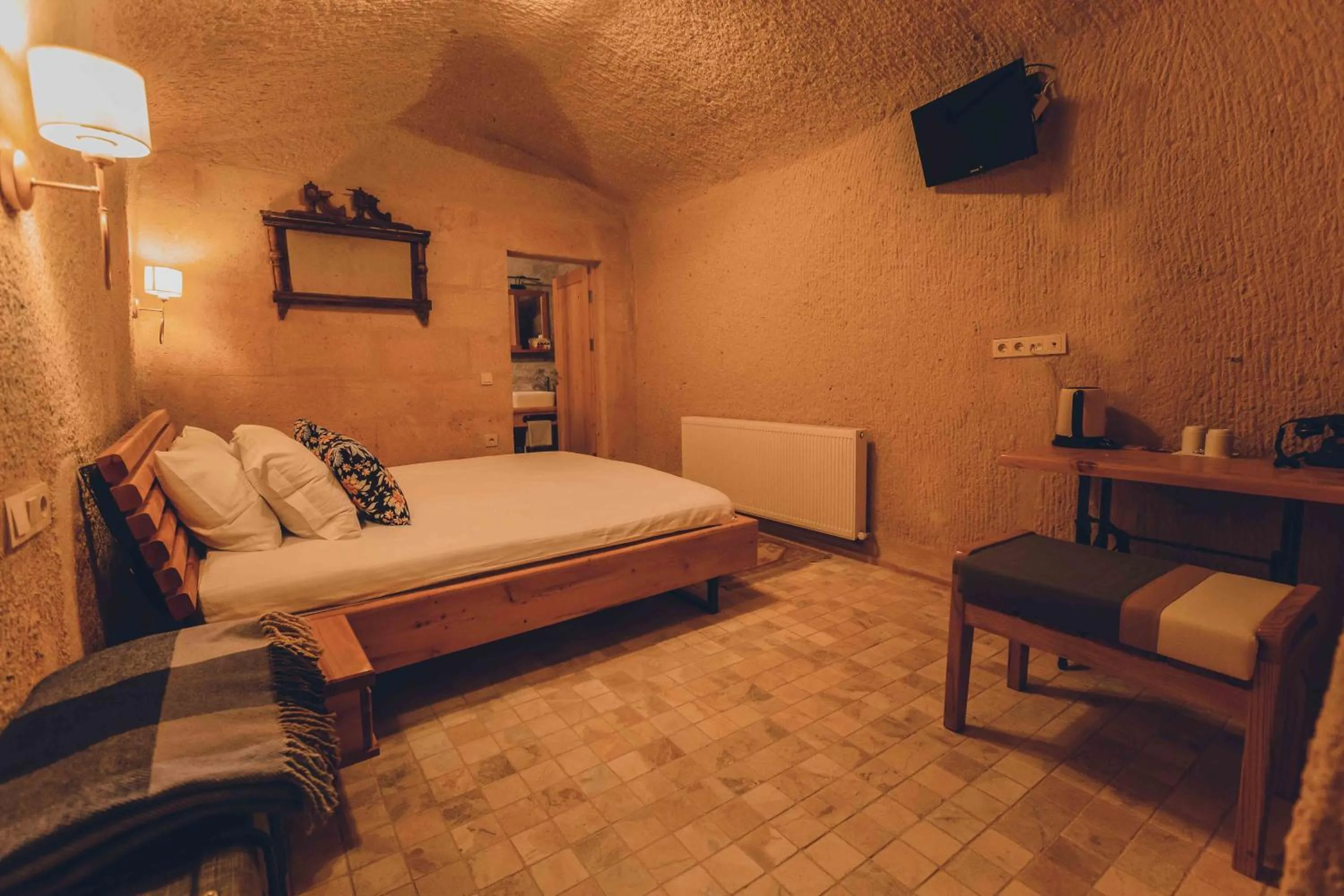 Bed in Pinhan Cave Suites