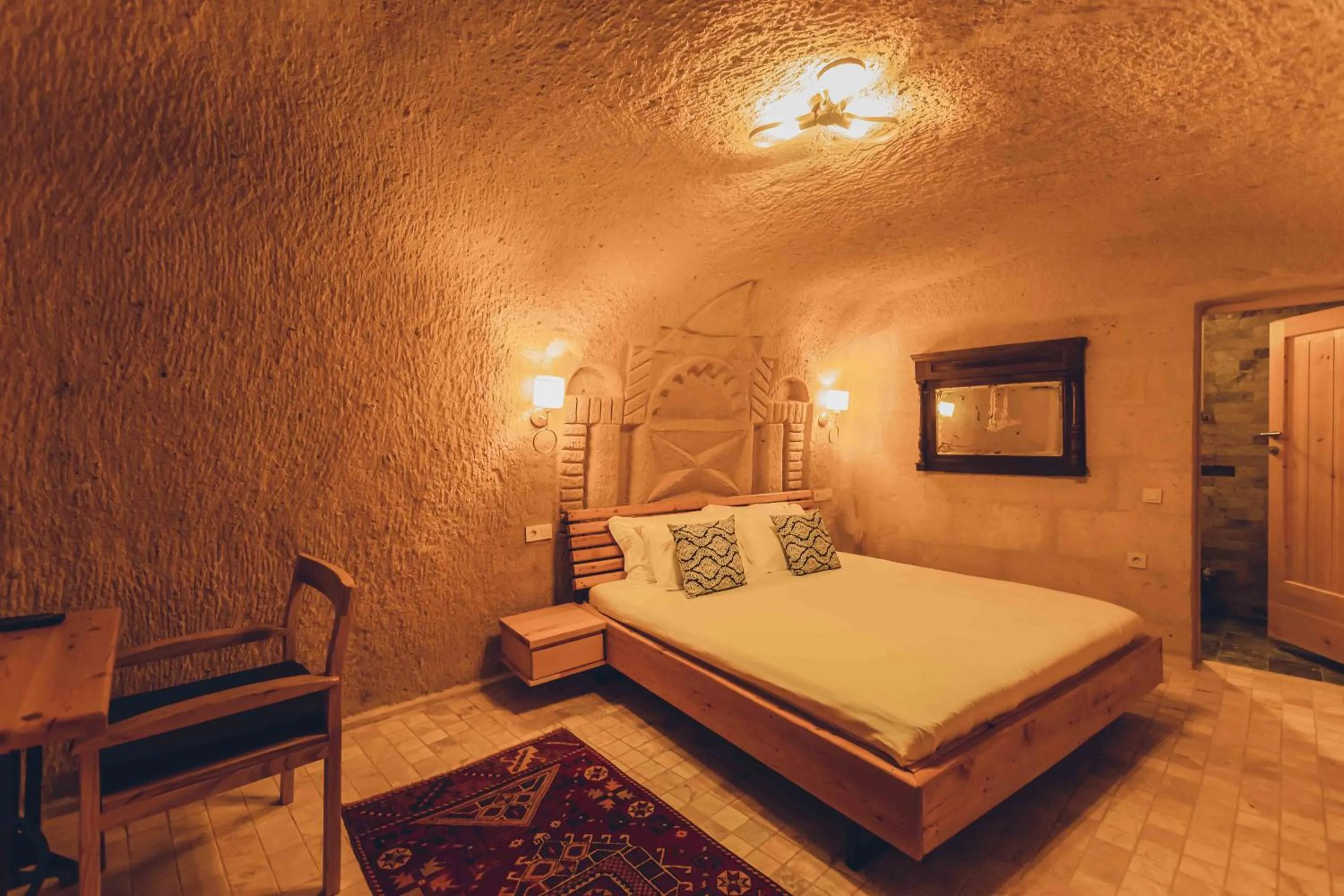 Bed in Pinhan Cave Suites