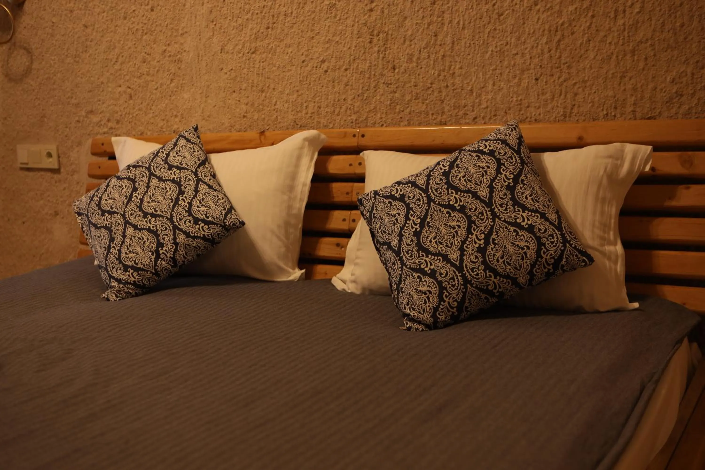 Bed in Pinhan Cave Suites