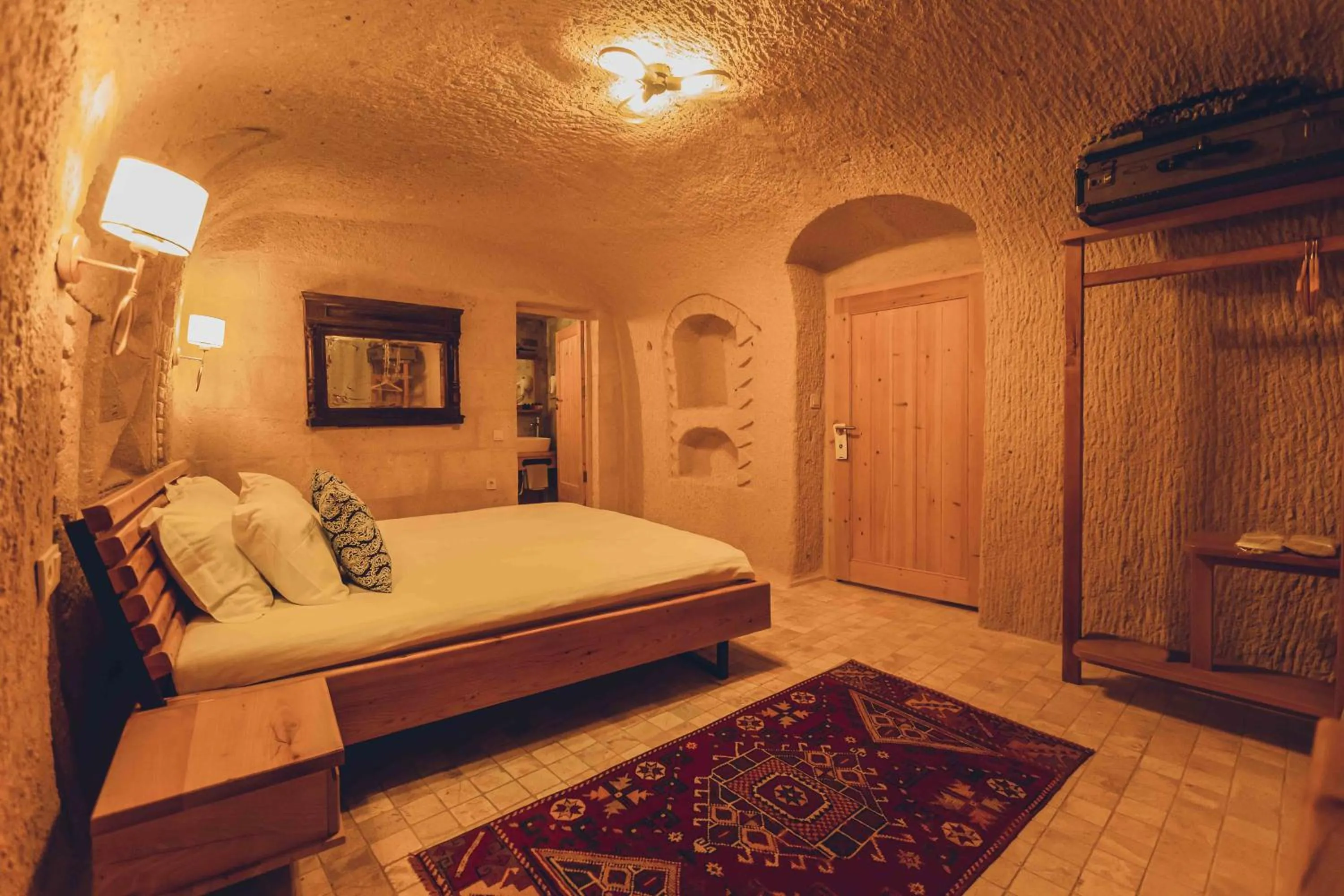 Bed in Pinhan Cave Suites