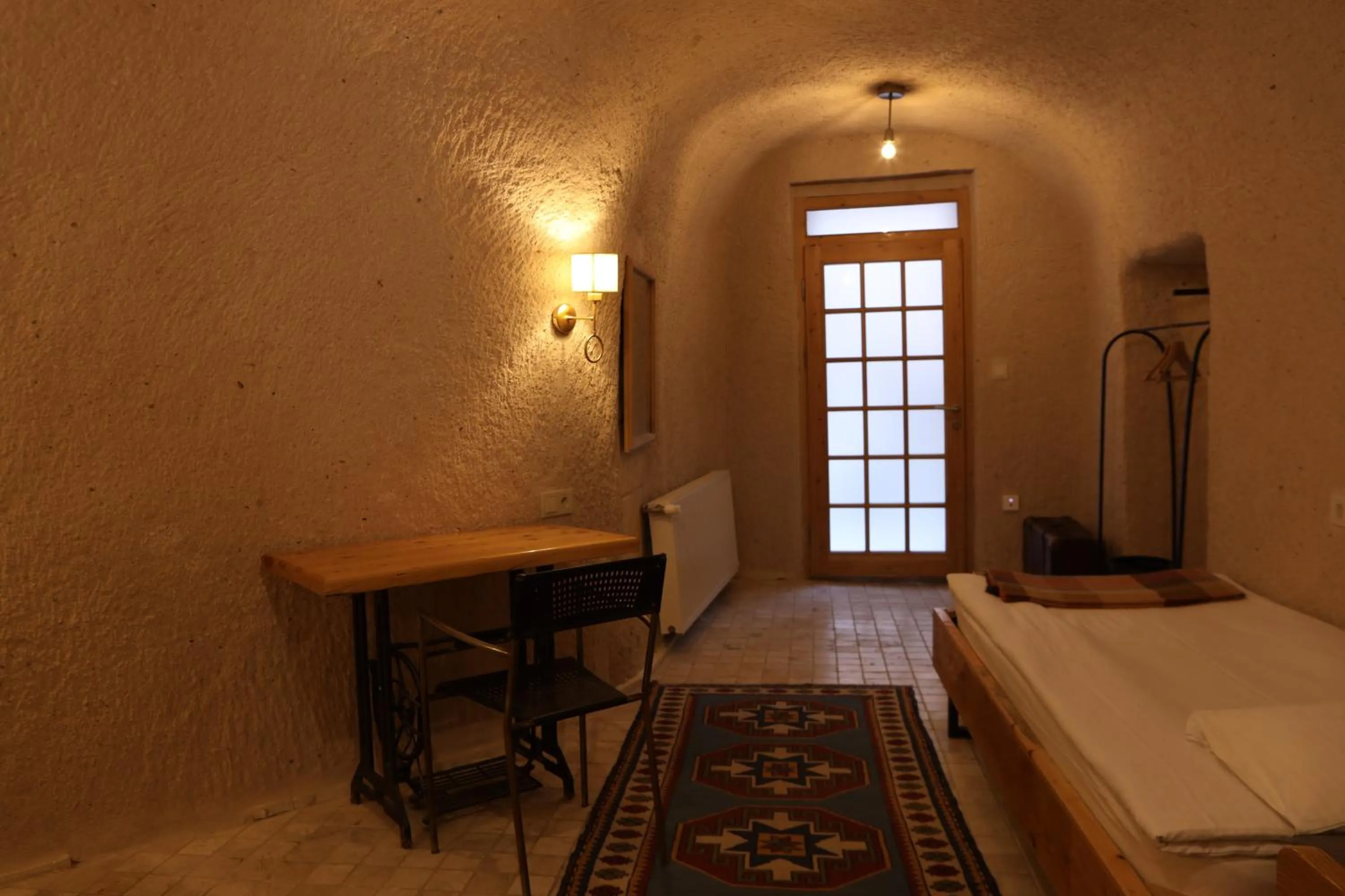 Bed in Pinhan Cave Suites