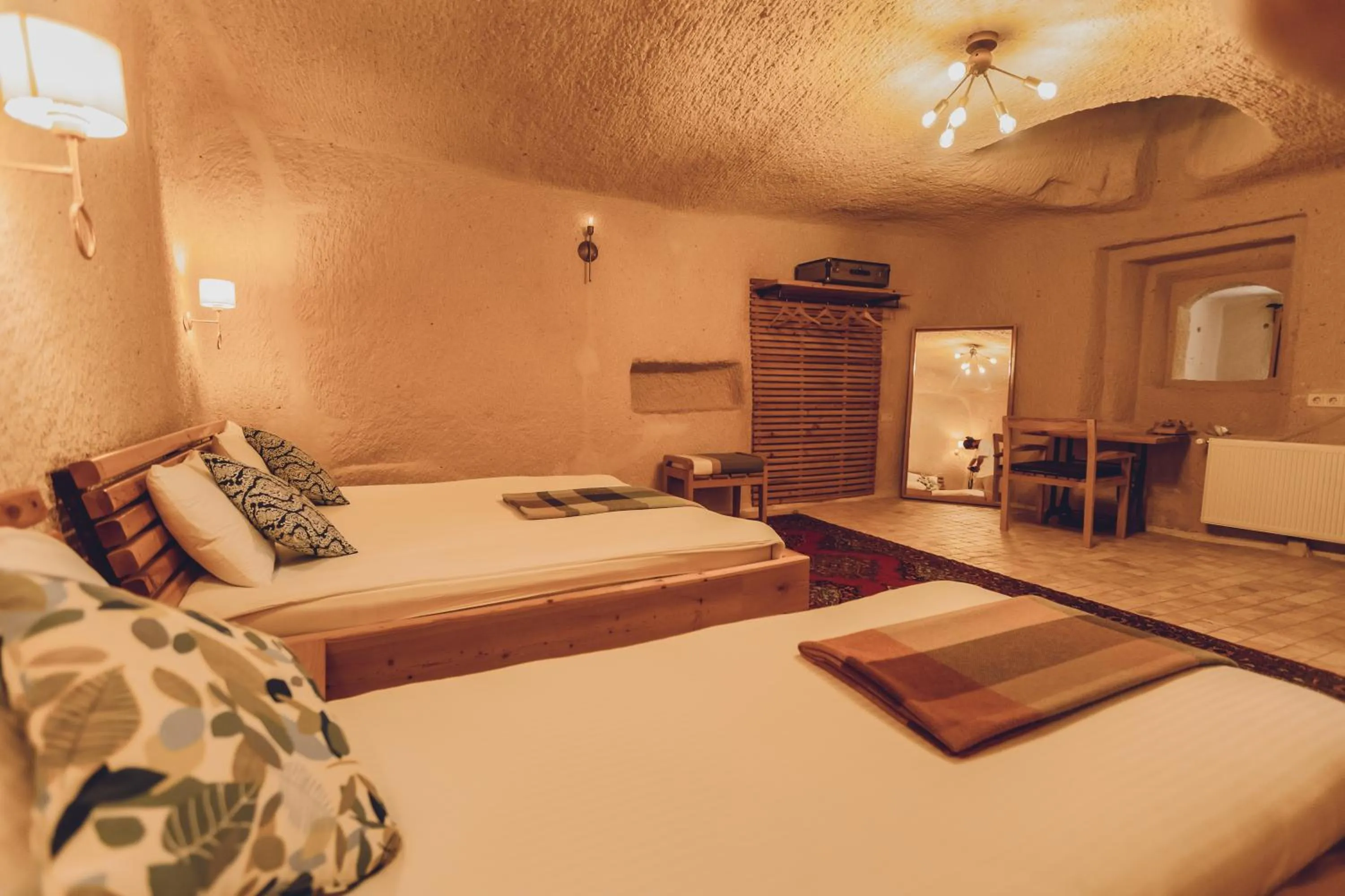 Bed in Pinhan Cave Suites