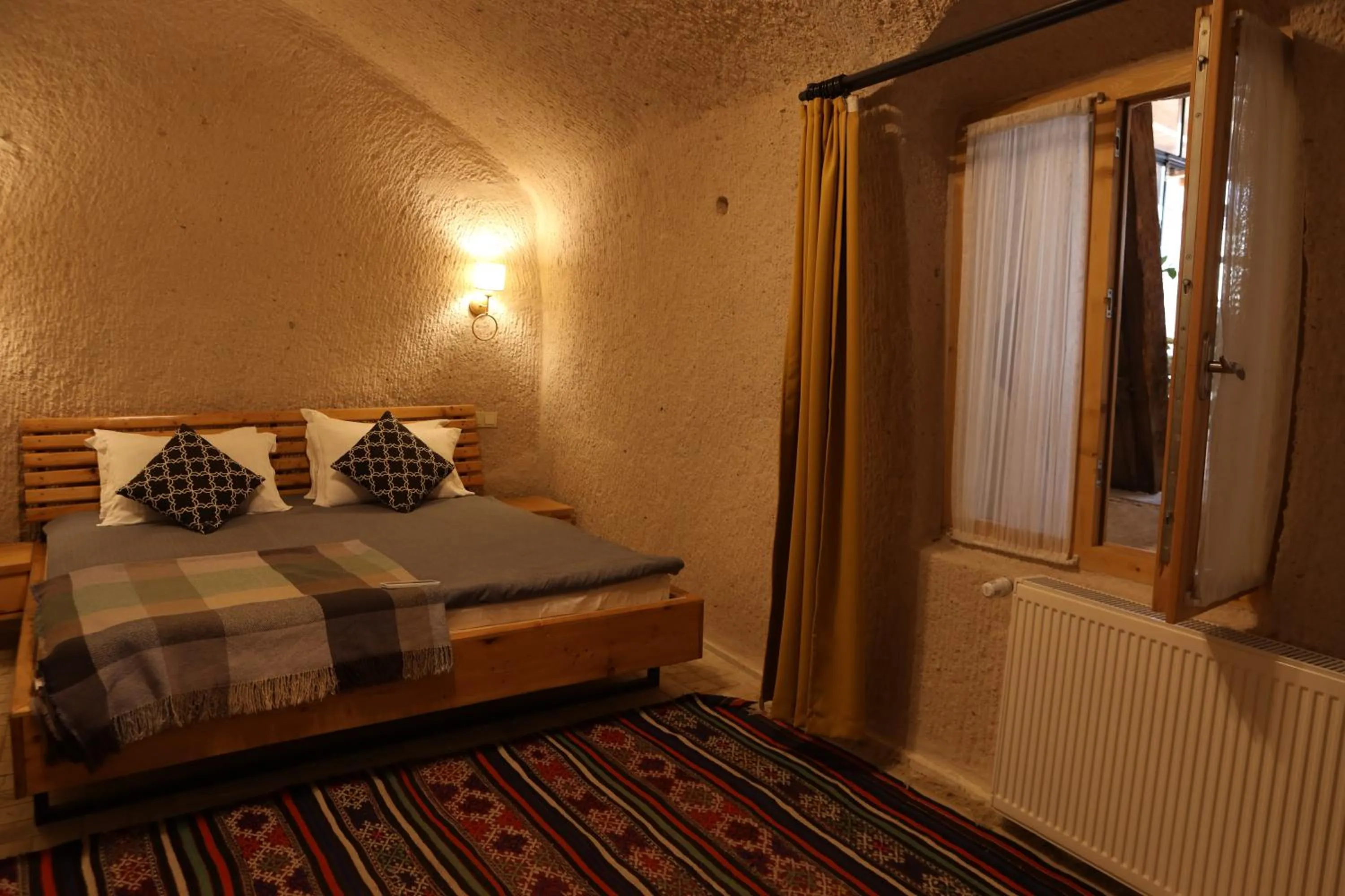 Bed in Pinhan Cave Suites