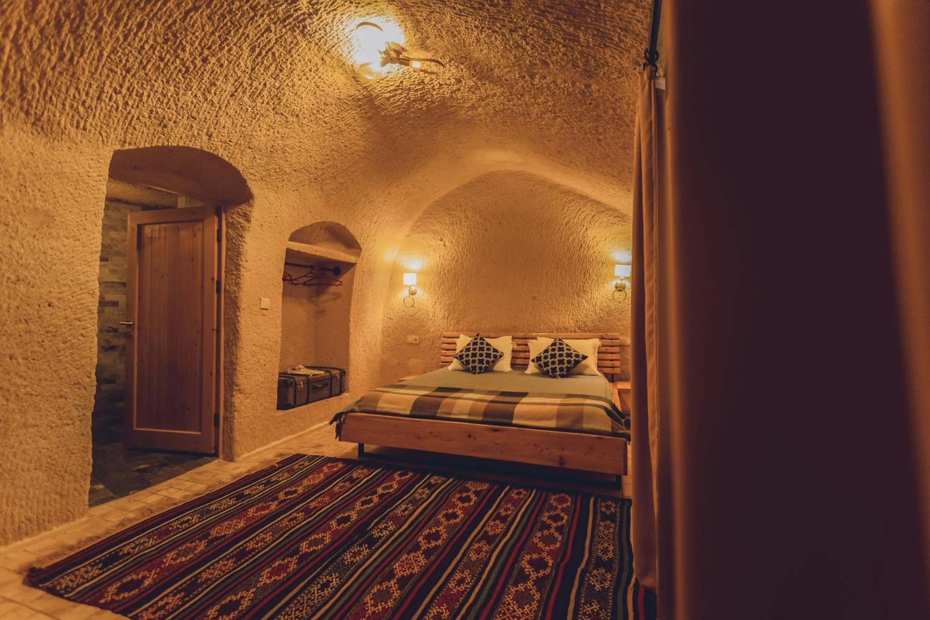 Bed in Pinhan Cave Suites