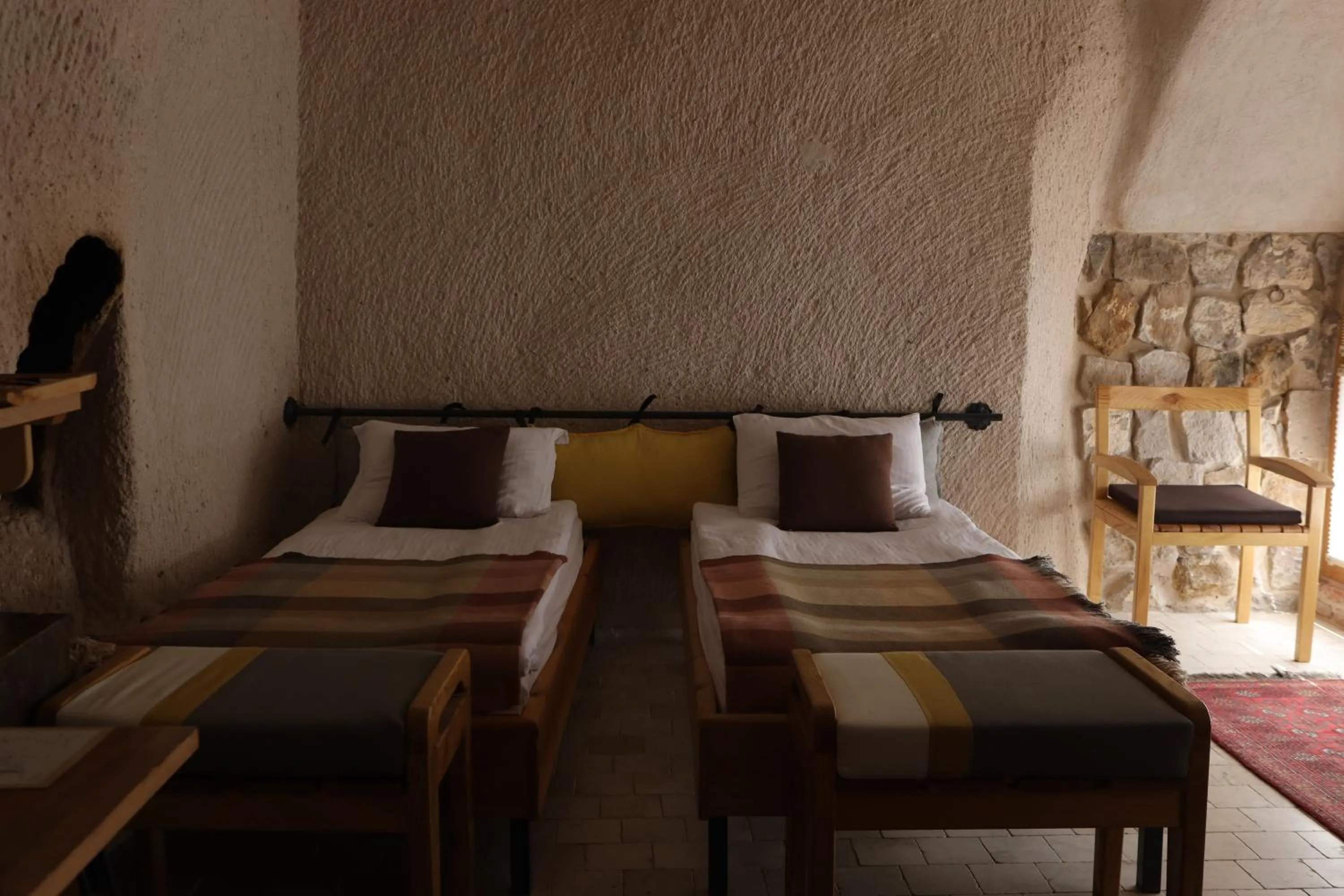 Bed in Pinhan Cave Suites
