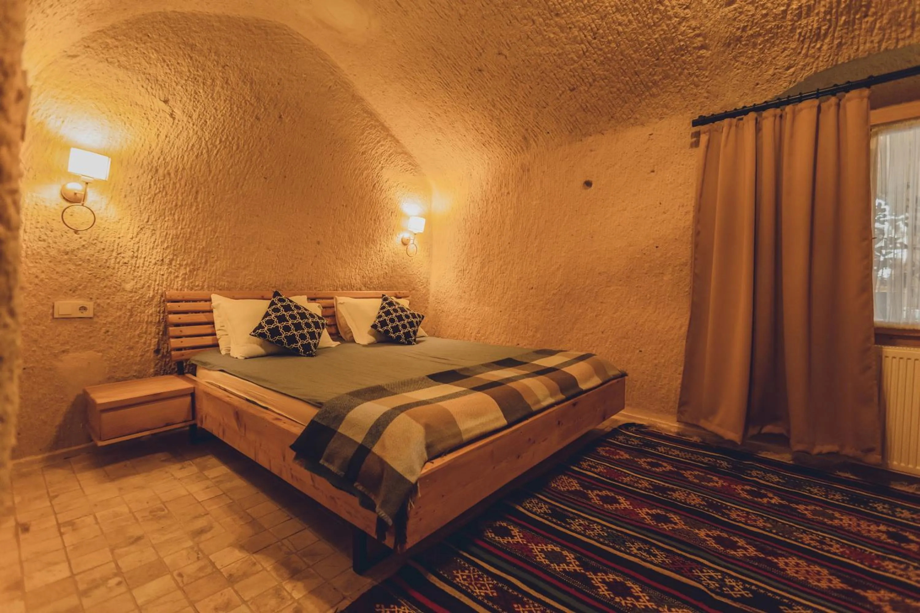 Bed in Pinhan Cave Suites