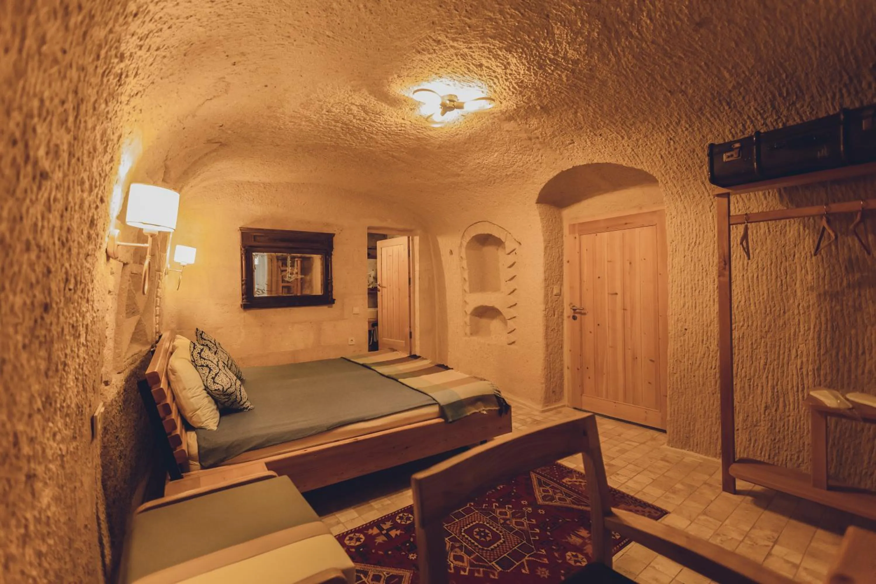 Bed in Pinhan Cave Suites