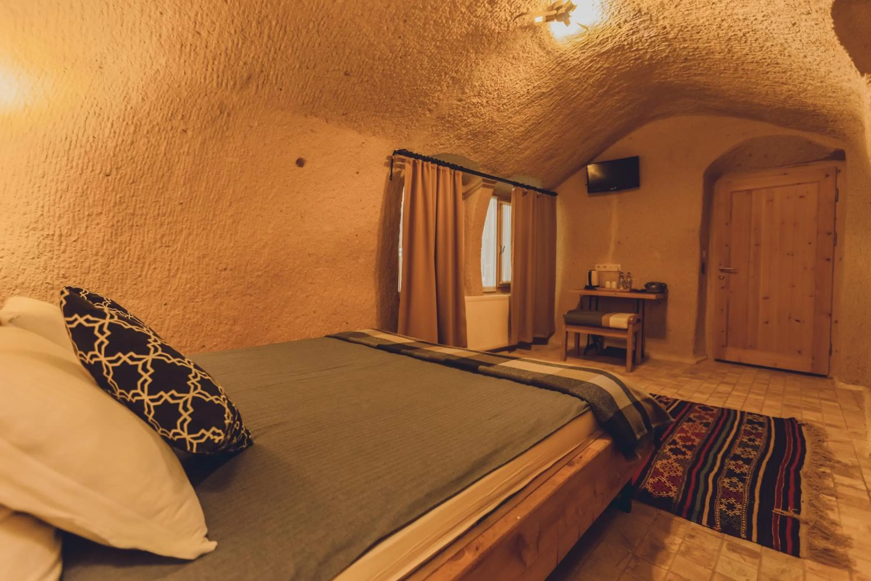Bed in Pinhan Cave Suites