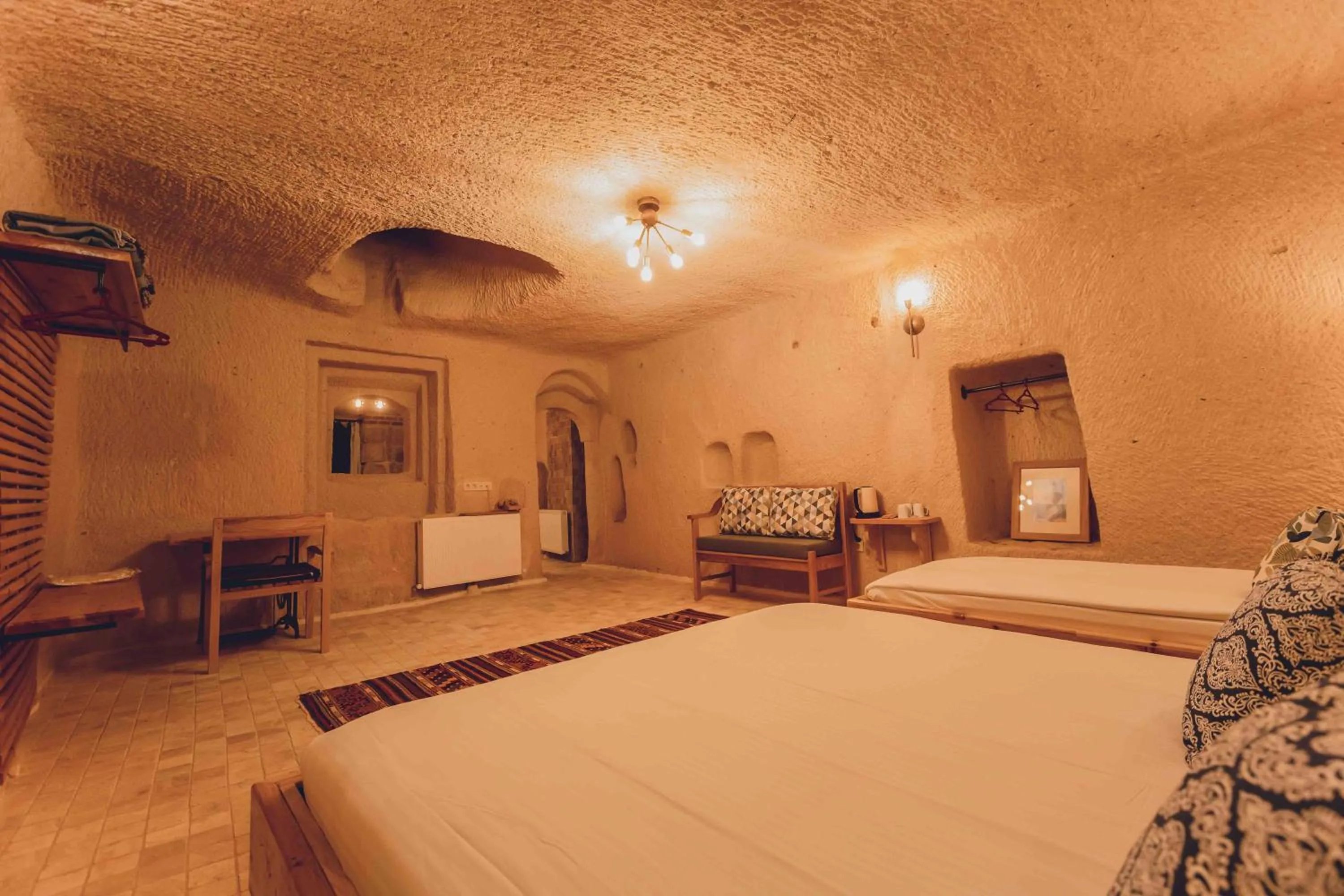 Bed in Pinhan Cave Suites