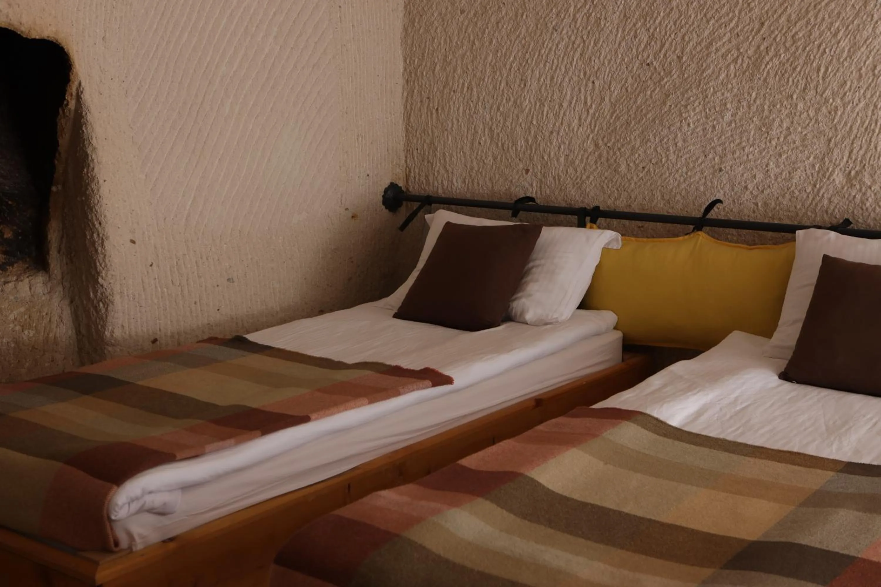 Bed in Pinhan Cave Suites