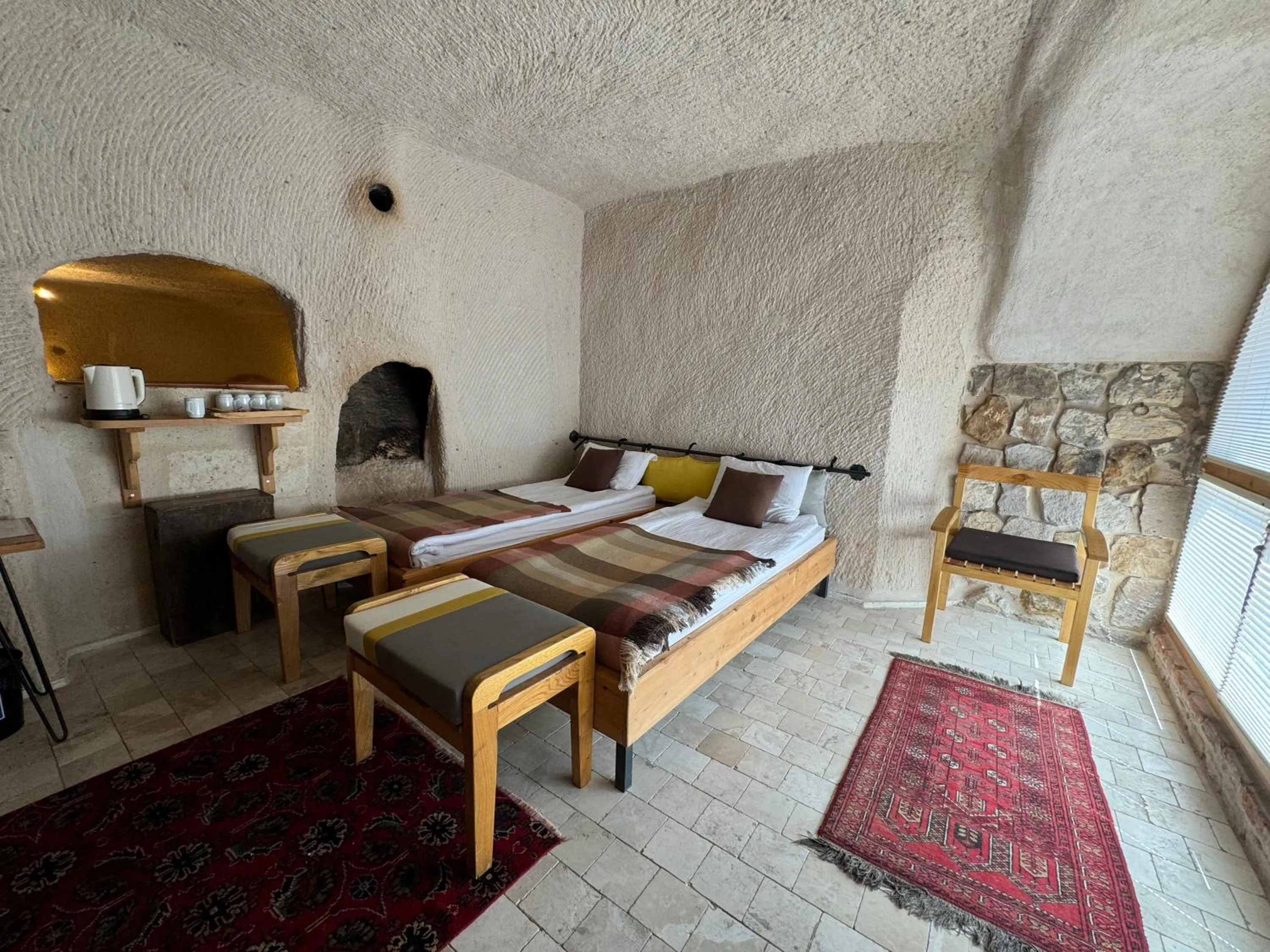 Bed in Pinhan Cave Suites